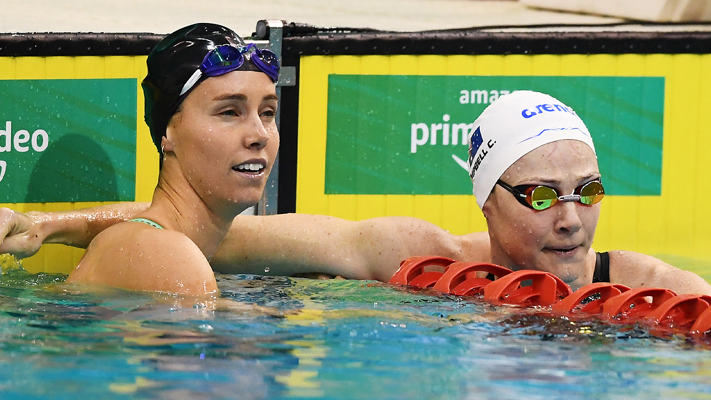 Emma McKeon and second place Cate Campbell after she won the Women's 100 metre Freestyle final during the Australian National Olympic Swimming Trials