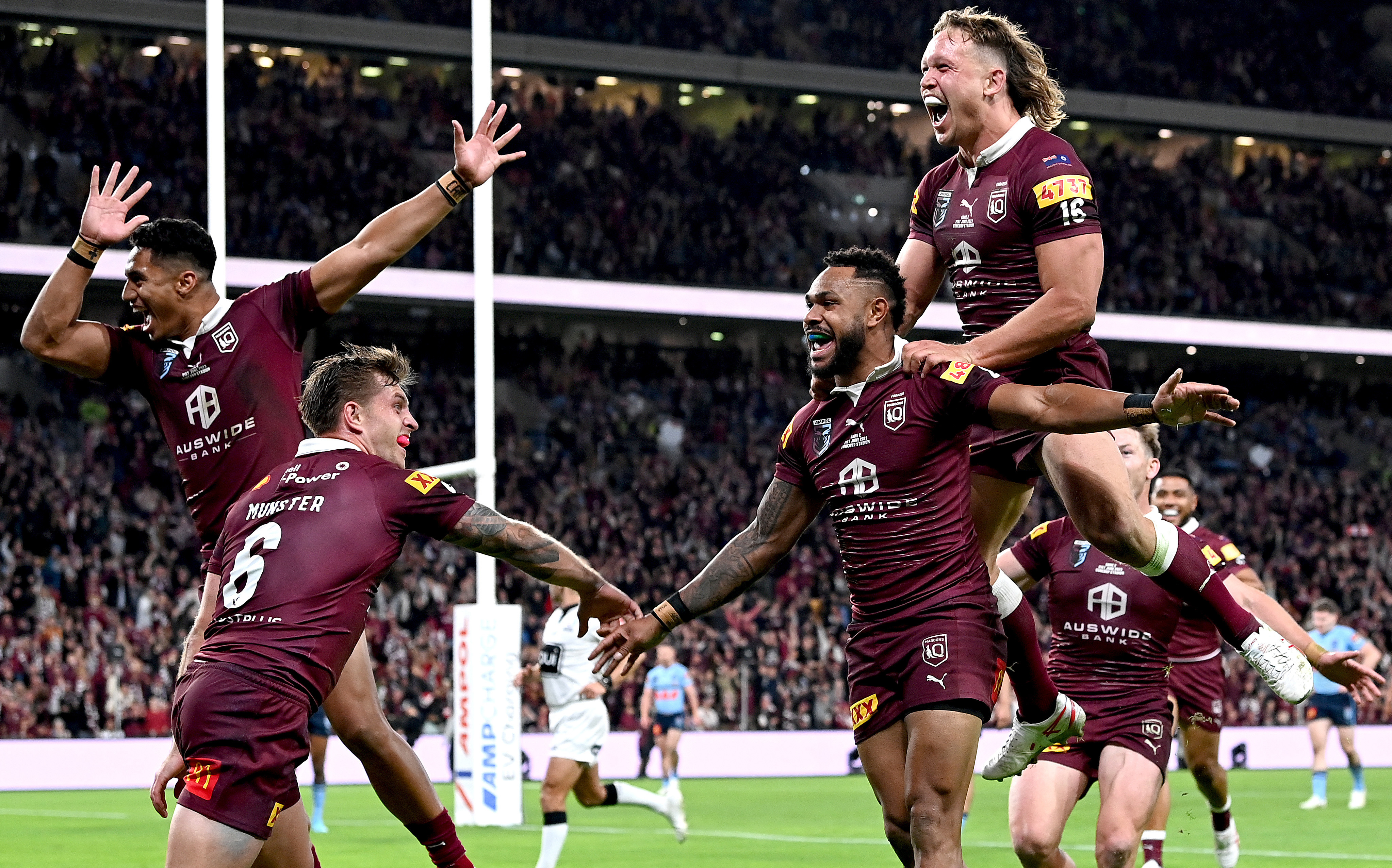 Hamiso Tabuai-Fidow of Queensland celebrates with team mates after scoring a try during game two of the State of Origin series between the Queensland Maroons and the New South Wales Blues at Suncorp Stadium on June 21, 2023 in Brisbane, Australia. (Photo by Bradley Kanaris/Getty Images)