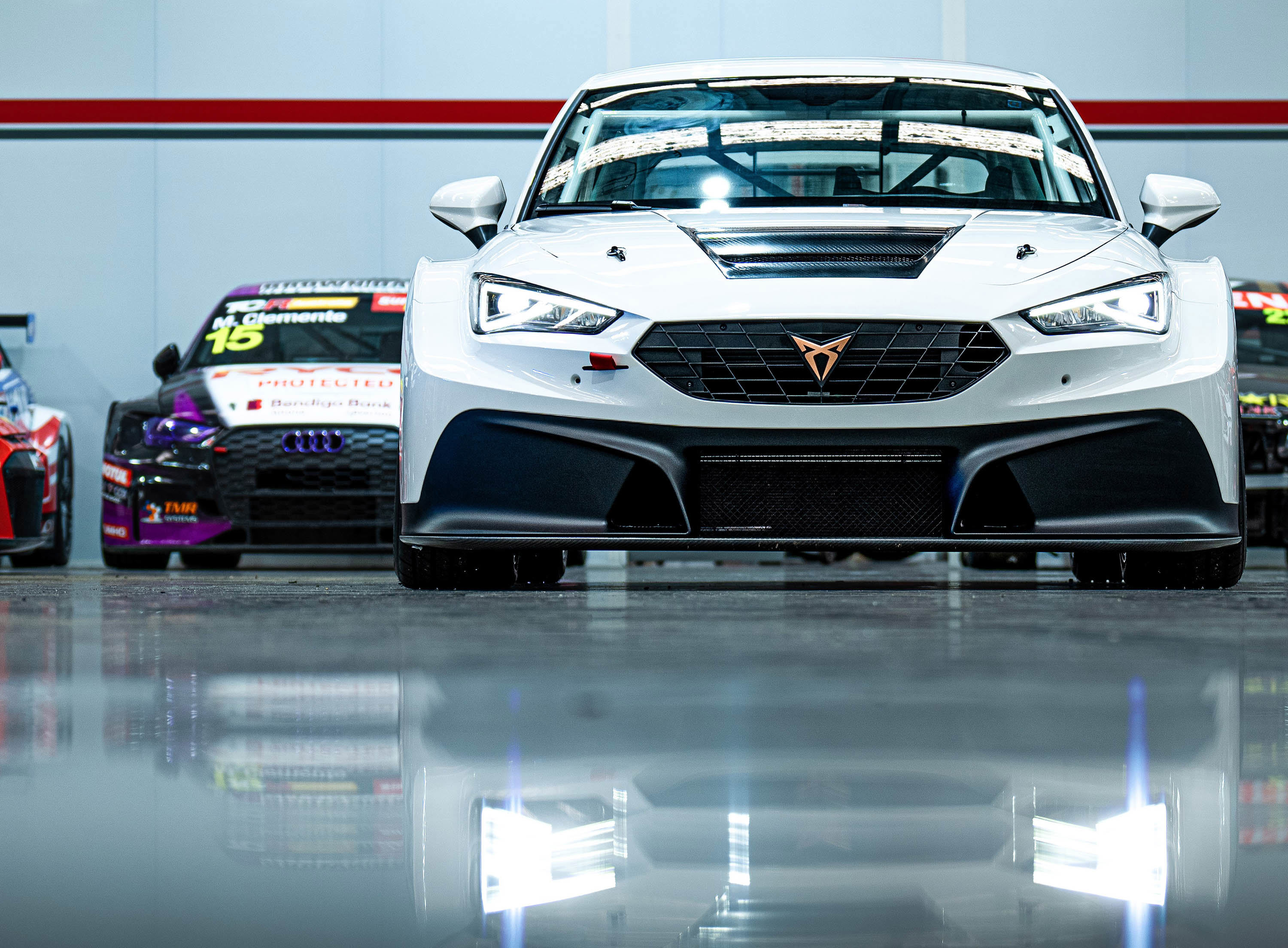 The new Cupra Leon Competicion with Michael Clemente's old Audi RS3 LMS behind it.
