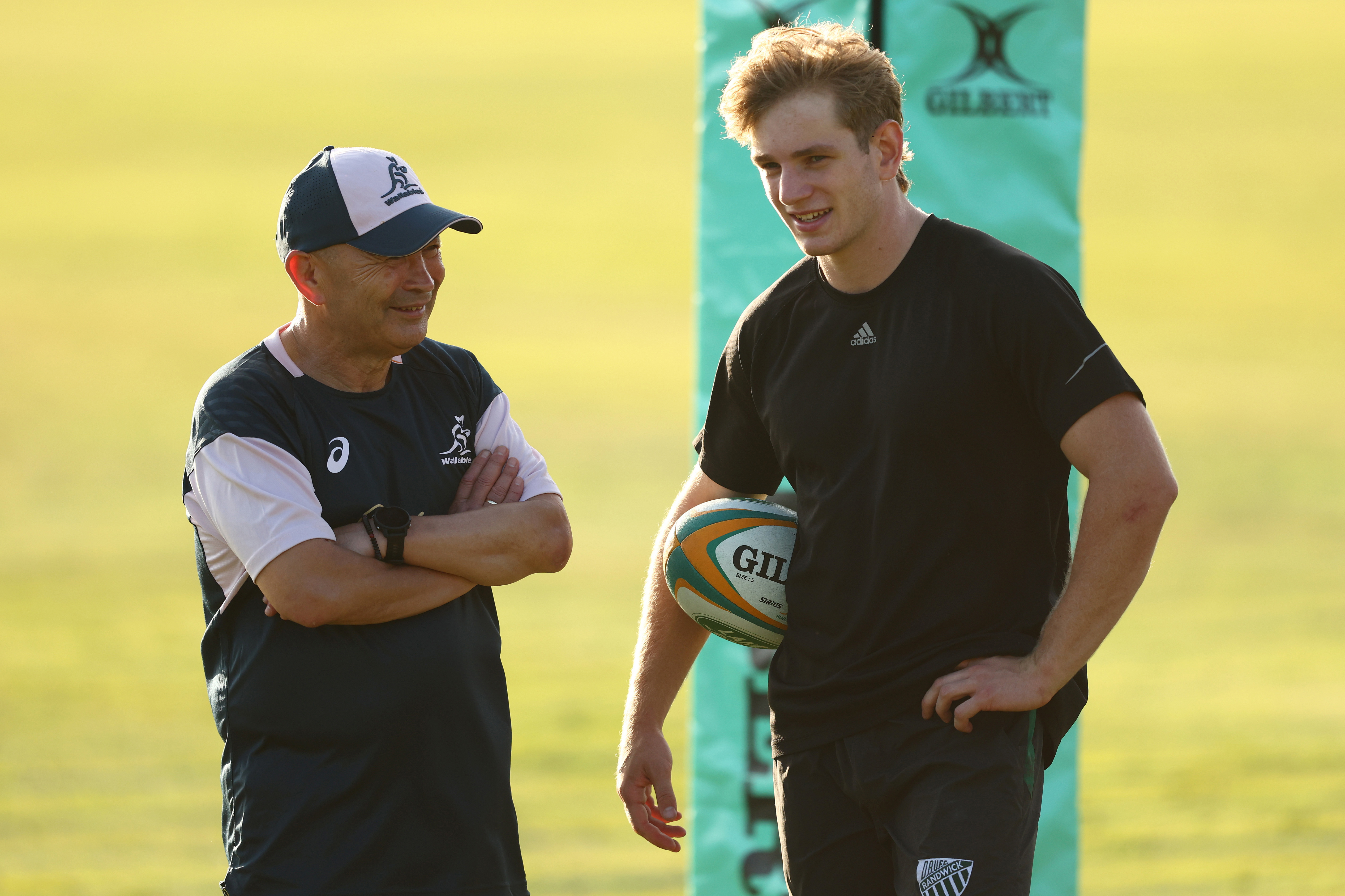 Wallabies coach Eddie Jones talks with Max Jorgensen during an Australia Wallabies training camp at Sanctuary Cove.