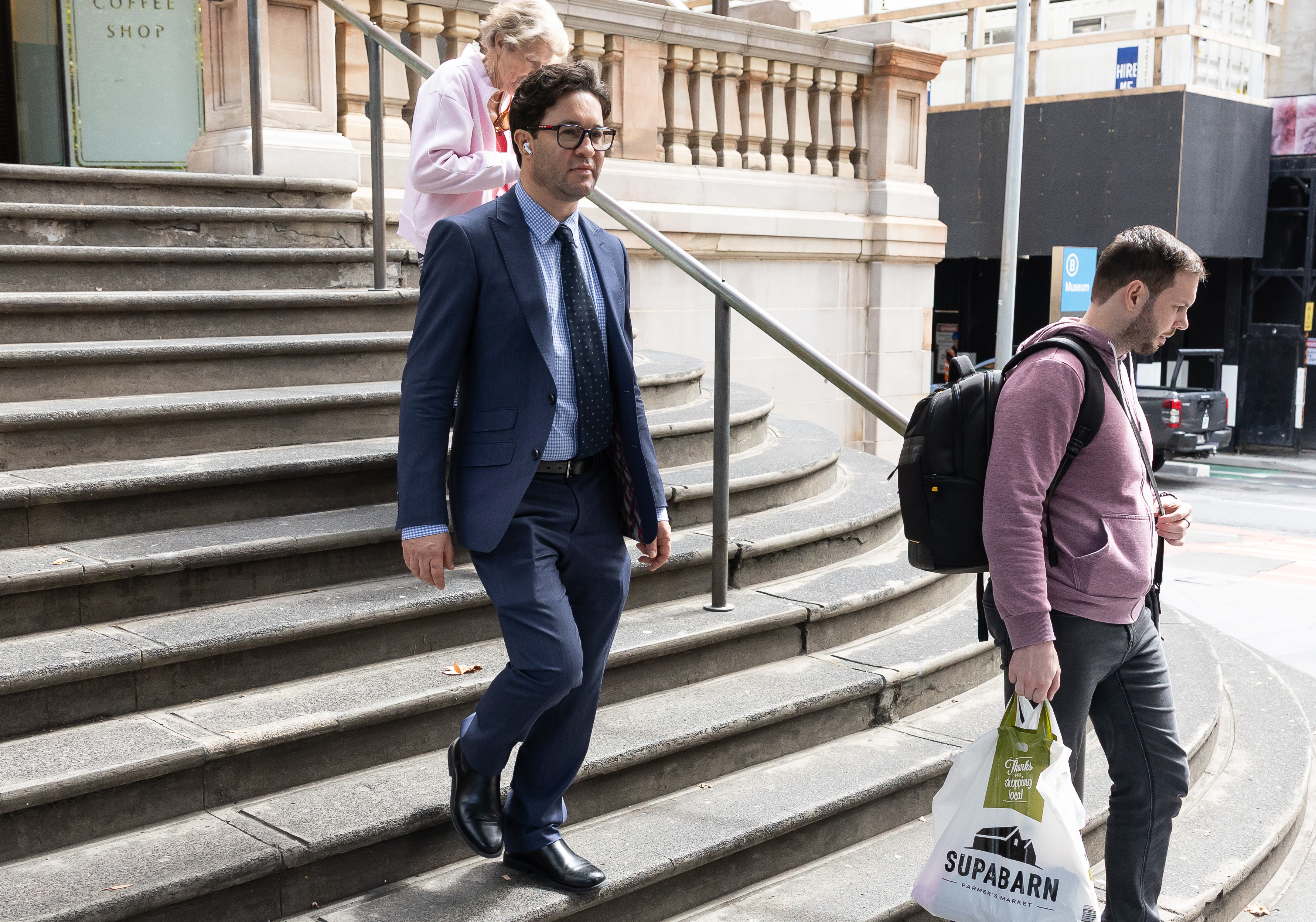 NEWS: David Charles Massa, (blue suit) accused of raping another man inside a nightclub on Oxford Street, departs Downing Centre courts.  January 2026, Photo: Wolter Peeters, The Sydney Morning Herald.