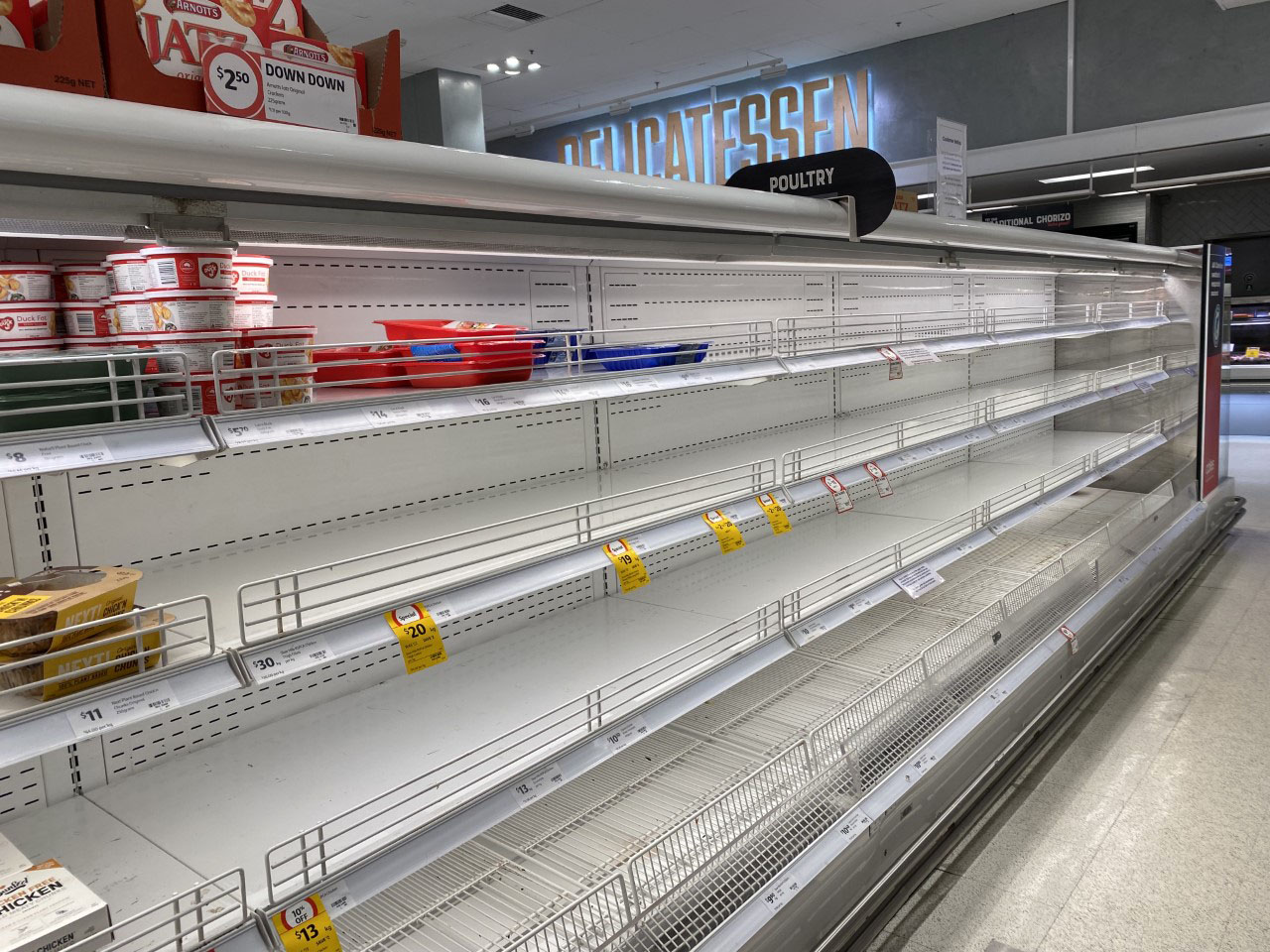 Empty supermarket shelves at Coles