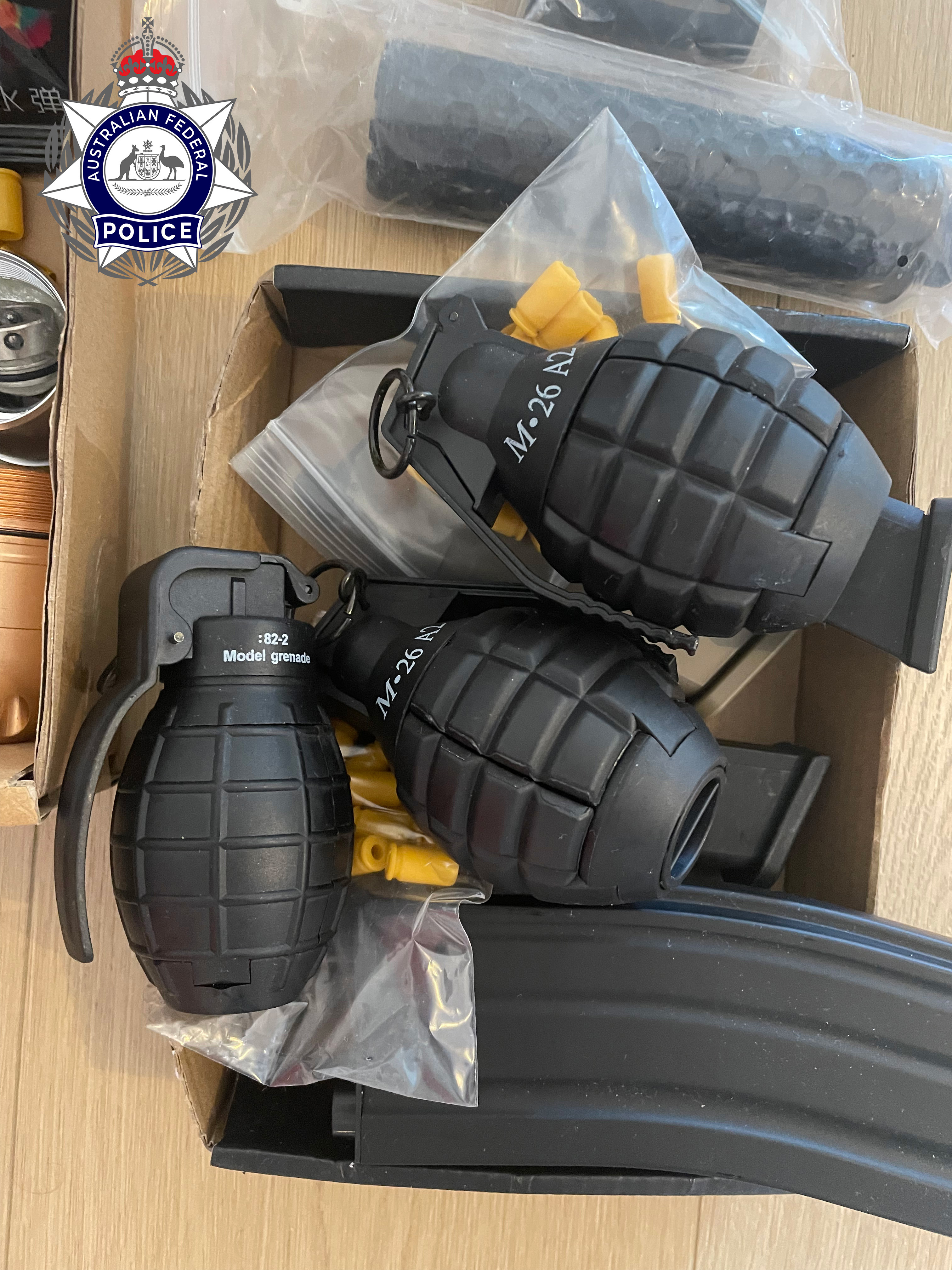 Fake grenades found at the address of a man allegedly impersonating an AFP officer.