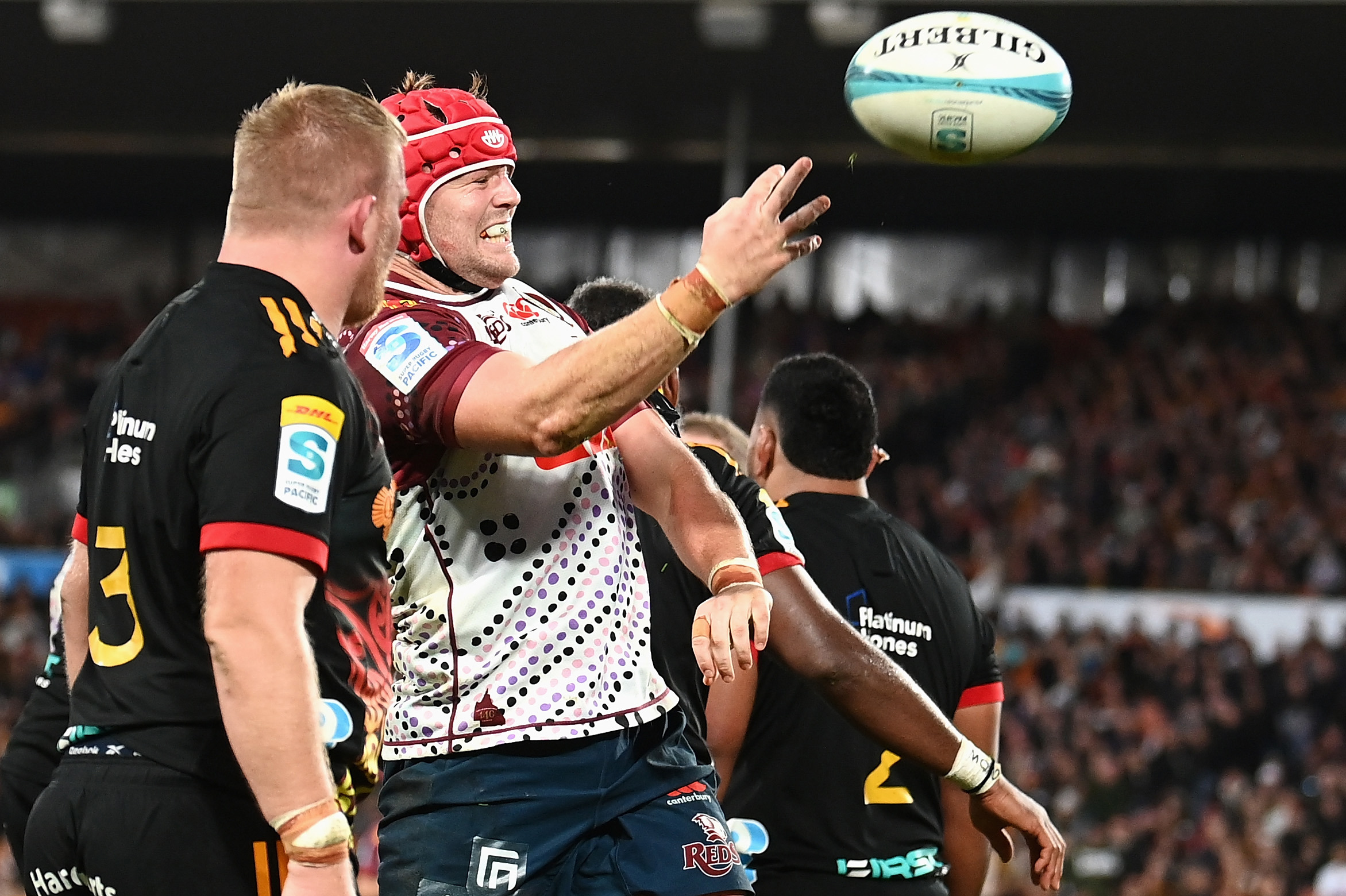 Harry Wilson of the Reds celebrates scoring a try.