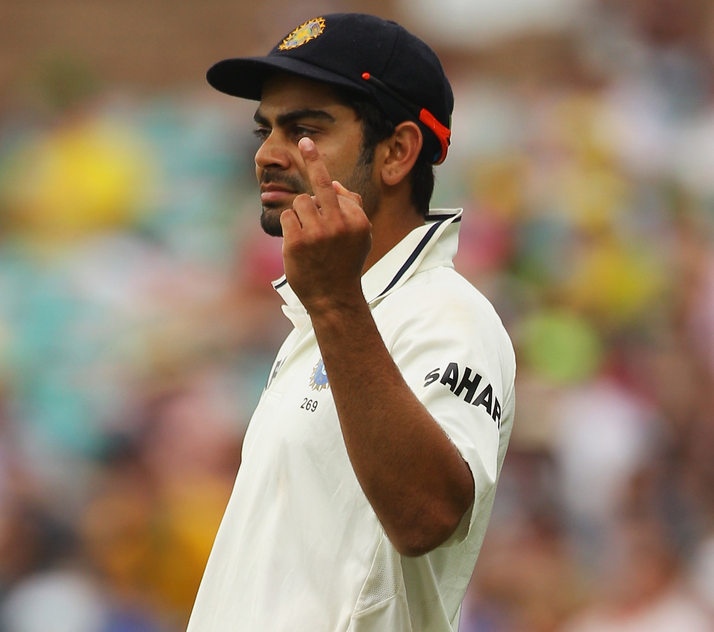 Virat Kohli flips off at a heckling SCG crowd during the Sydney Test of 2012.