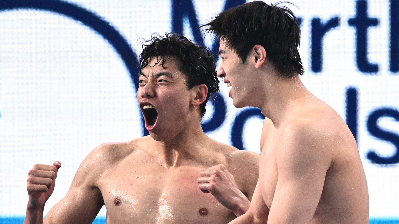 Xinjie Ji and Zhanle Pan of Team People's Republic of China celebrate during the Men's 4x100m Freestyle Final on day ten of the Doha 2024 World Aquatics Championships at Aspire Dome on February 11, 2024 in Doha, Qatar. (Photo by Quinn Rooney/Getty Images)