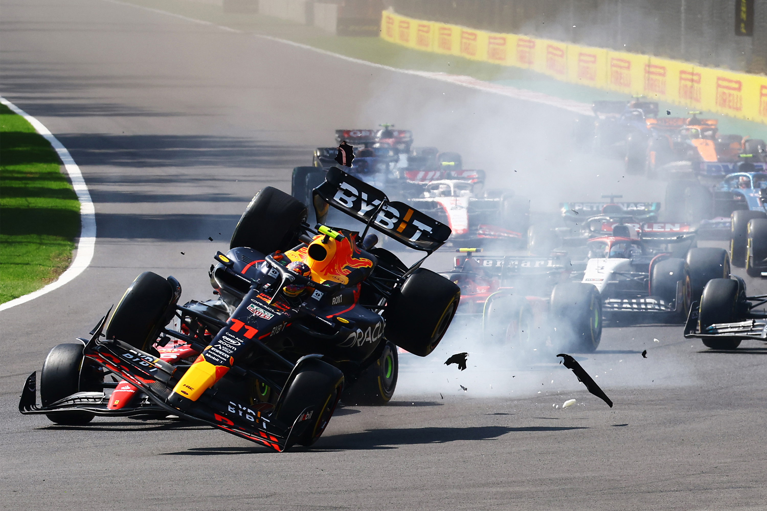 Sergio Perez is launched into the air afte rmaking contact with Charles Leclerc at turn one in the Mexico City Grand Prix.