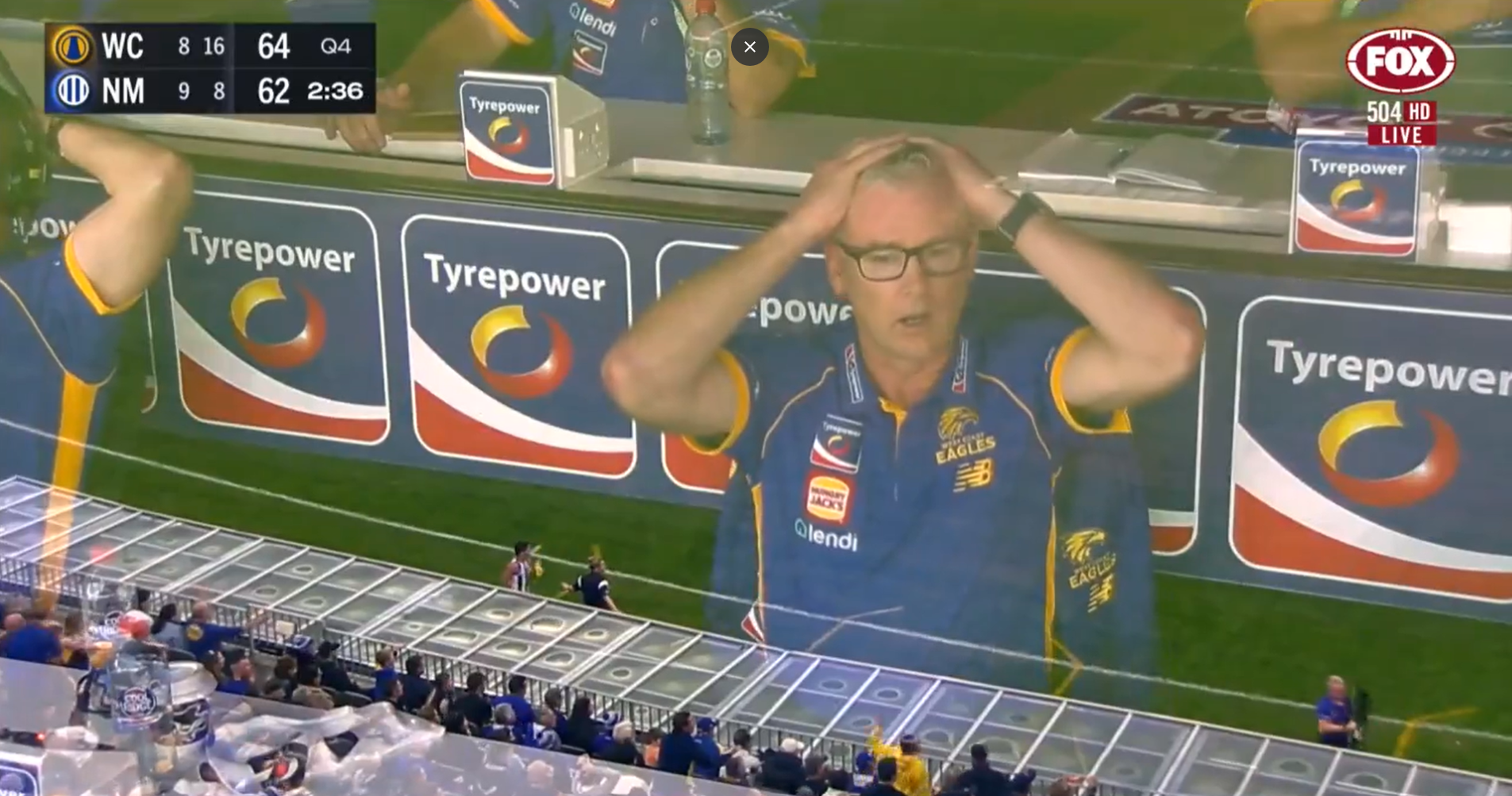 Adam Simpson looks on after umpire's call.