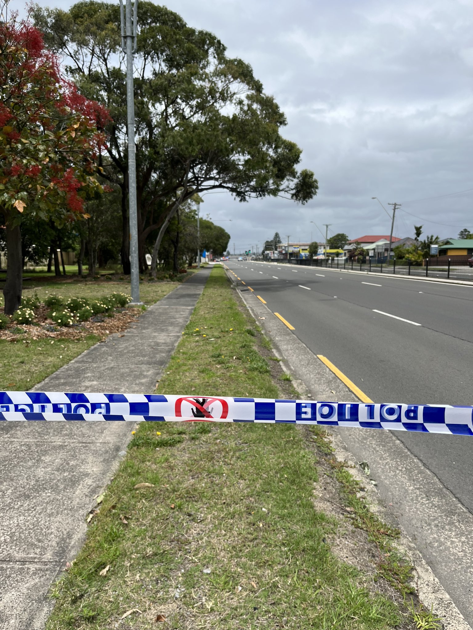 Police tape urging those near  Windang Road, Windang to avoid the area.