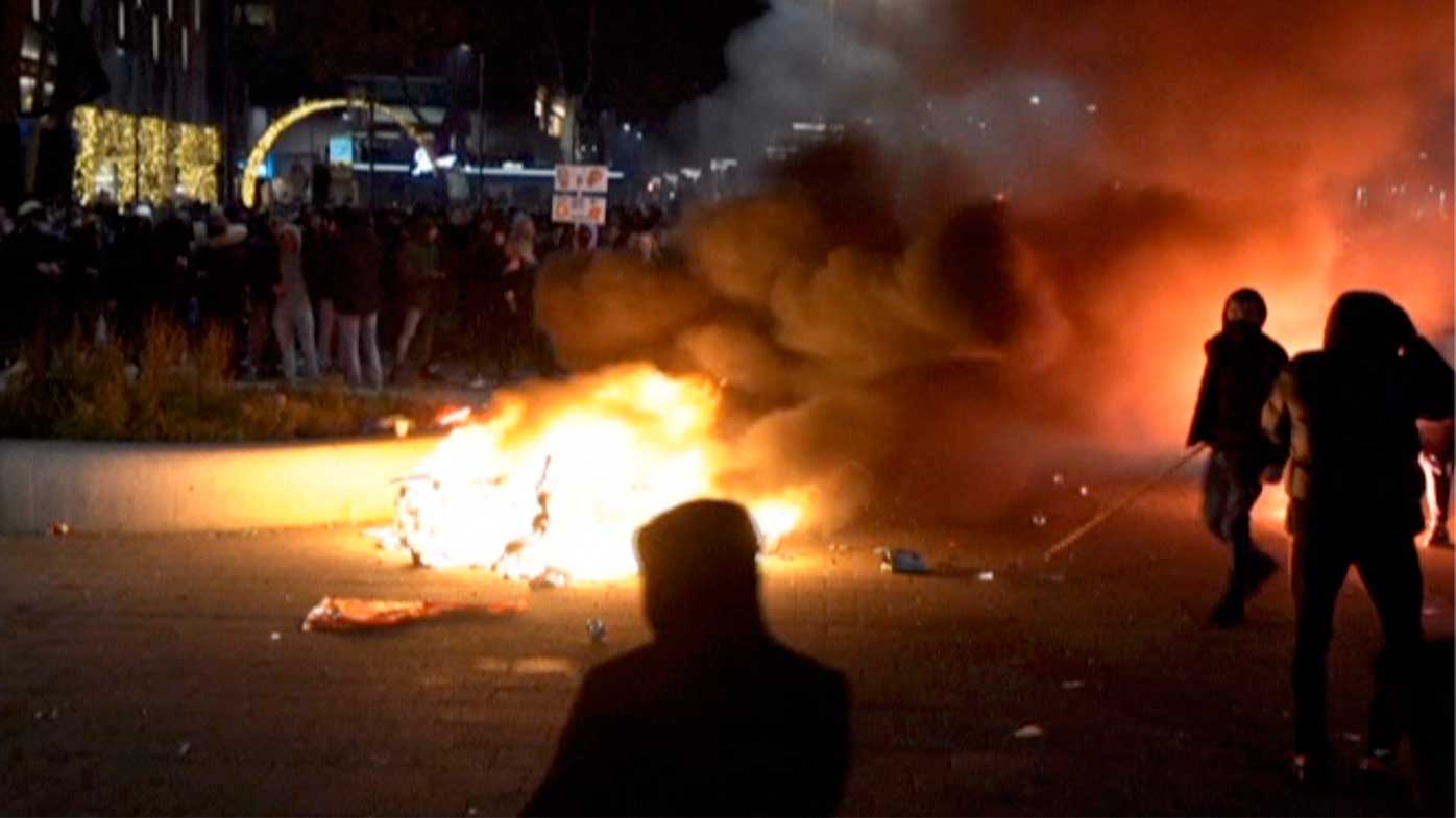 Demonstrators protest against government restrictions due to the coronavirus pandemic in Rotterdam.