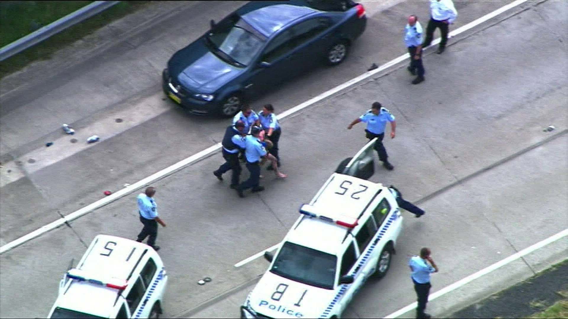More than a decade after a chaotic cross-border chase involving car-jackings, gunfire, and a desperate dash across M1 traffic a New South Wales police officer has finally been honoured for his bravery.