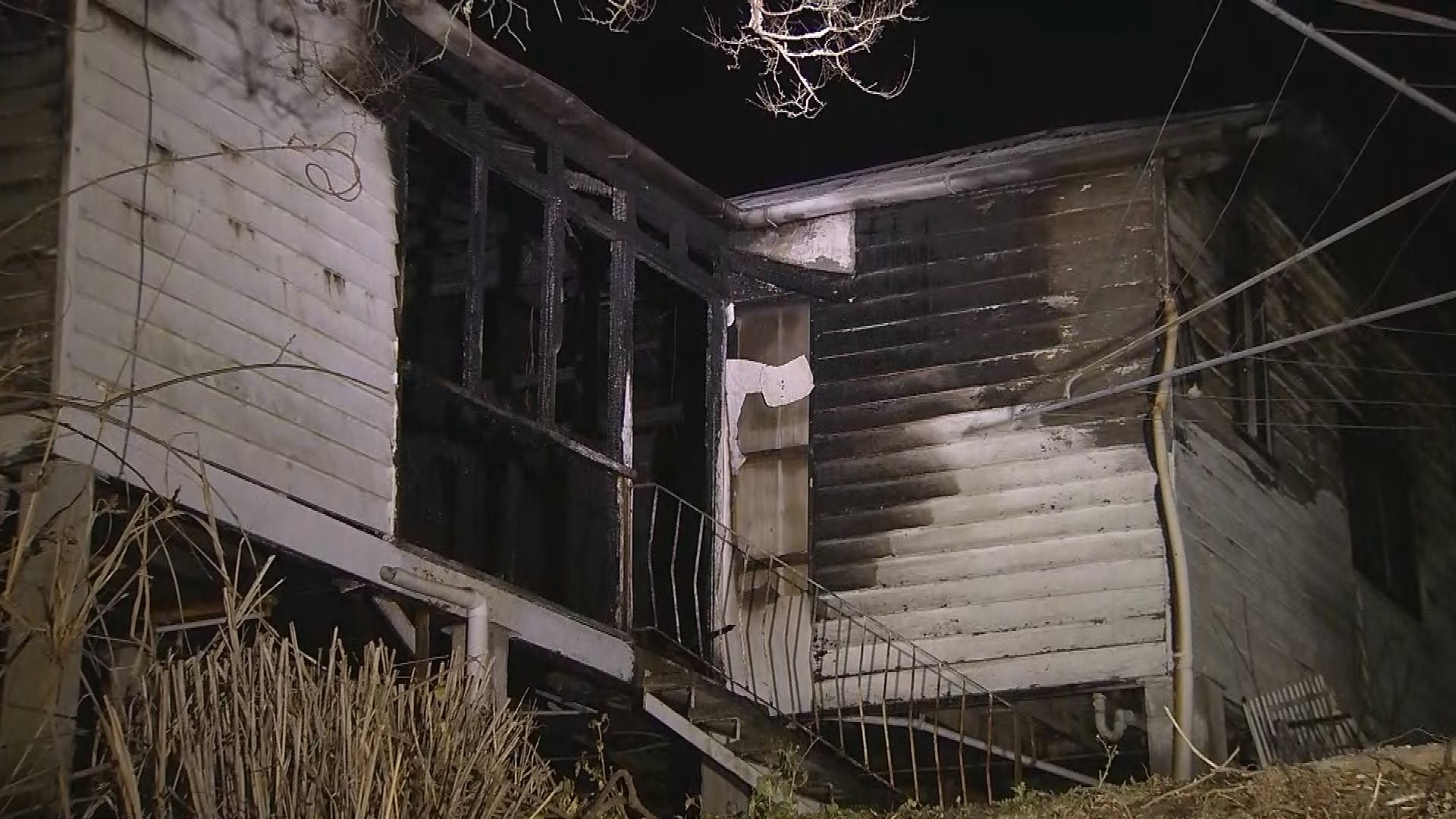 Two people have been pulled from their blazing home by heroic neighbours in Brisbane overnight.