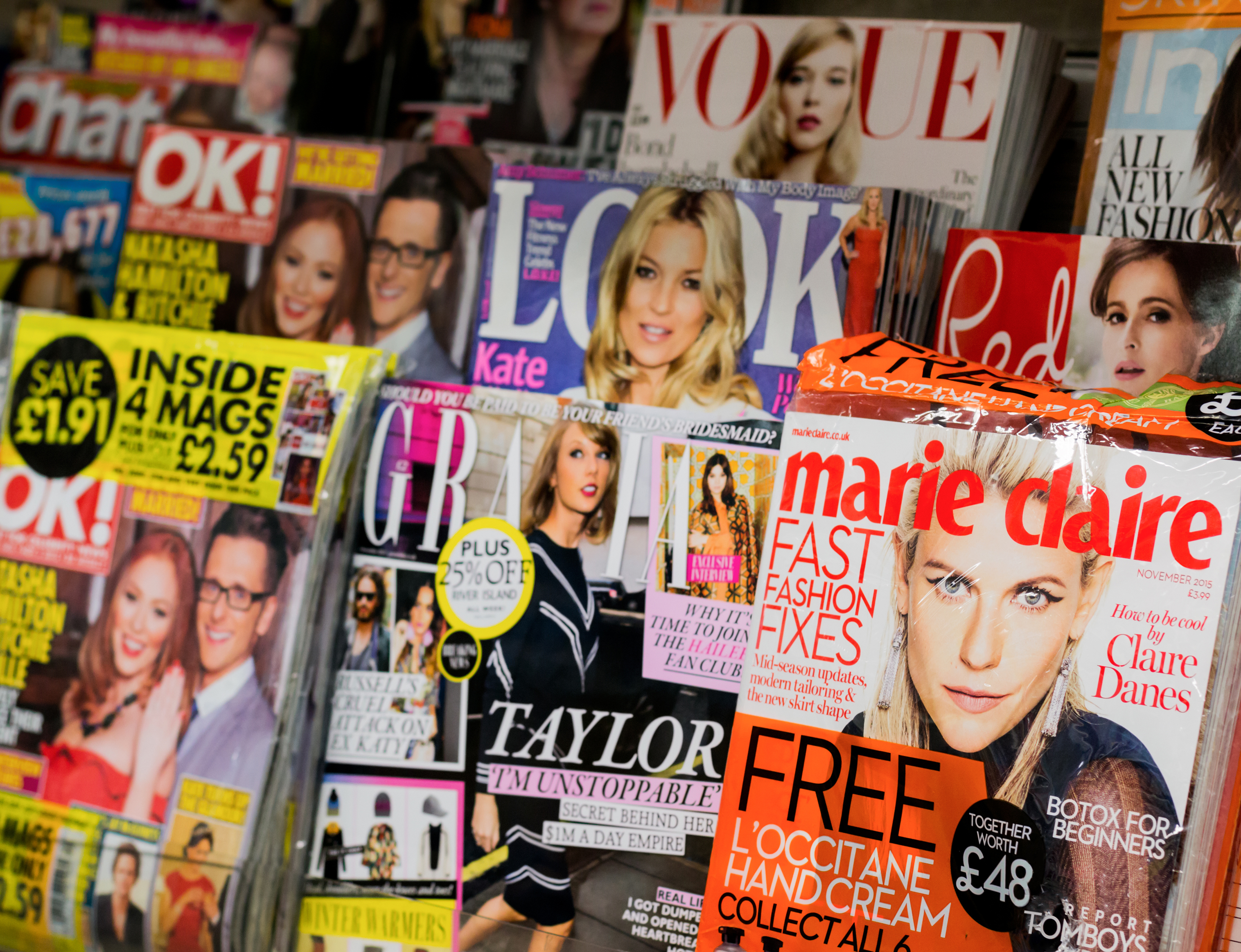 Newsstand found in central London displaying many international Women's and gossip titles such as Marie Claire, OK, Look, Red, Vogue UK, Grazia and Chat.