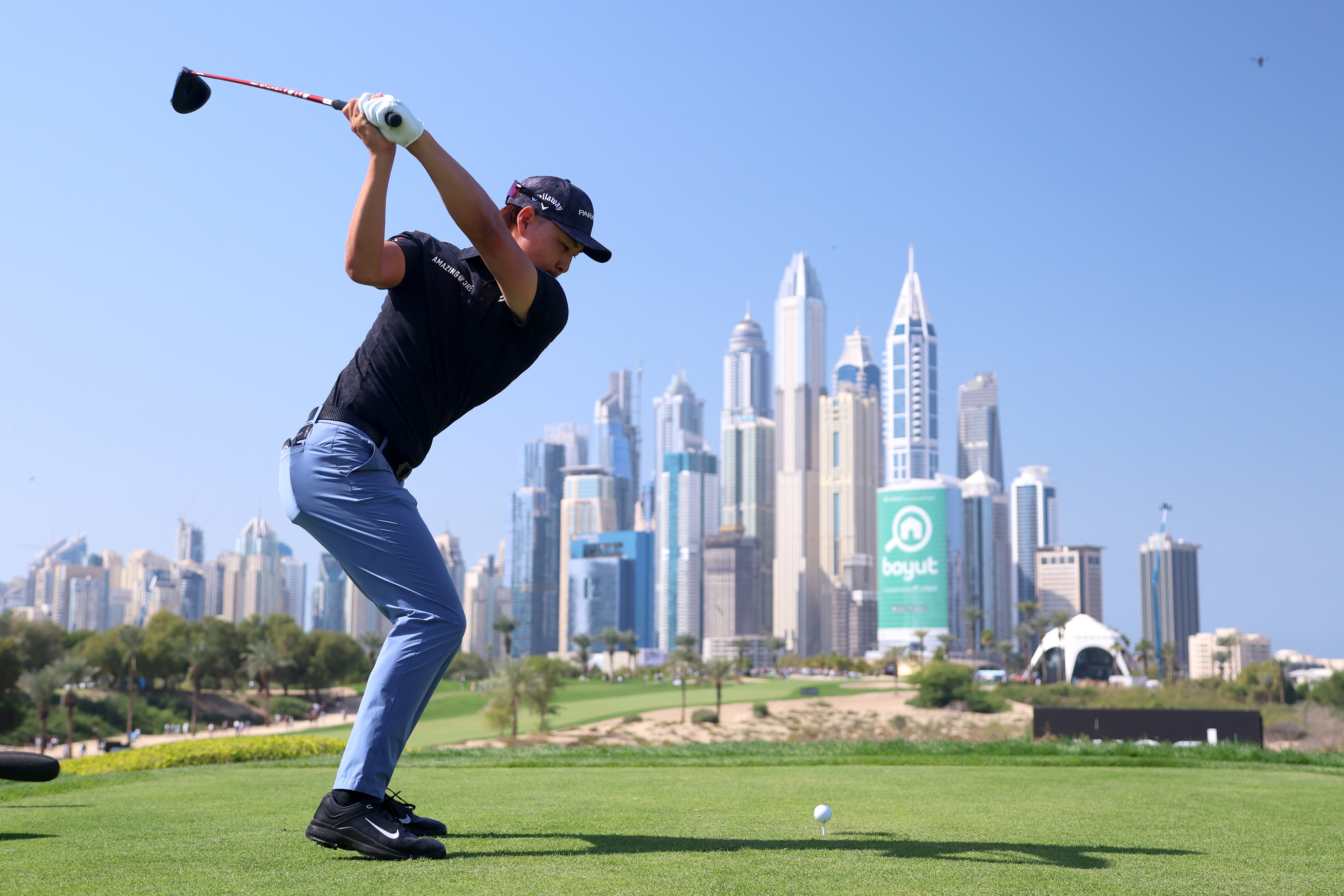 Min Woo Lee of Australia tees off on the 8th hole during the Third Round on Day Four of the Hero Dubai Desert Classic at Emirates Golf Club on January 29, 2023 in Dubai, United Arab Emirates. (Photo by Warren Little/Getty Images)