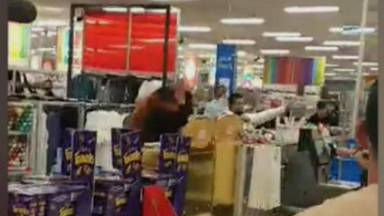 A wild brawl at a Kmart store has been caught on camera.
