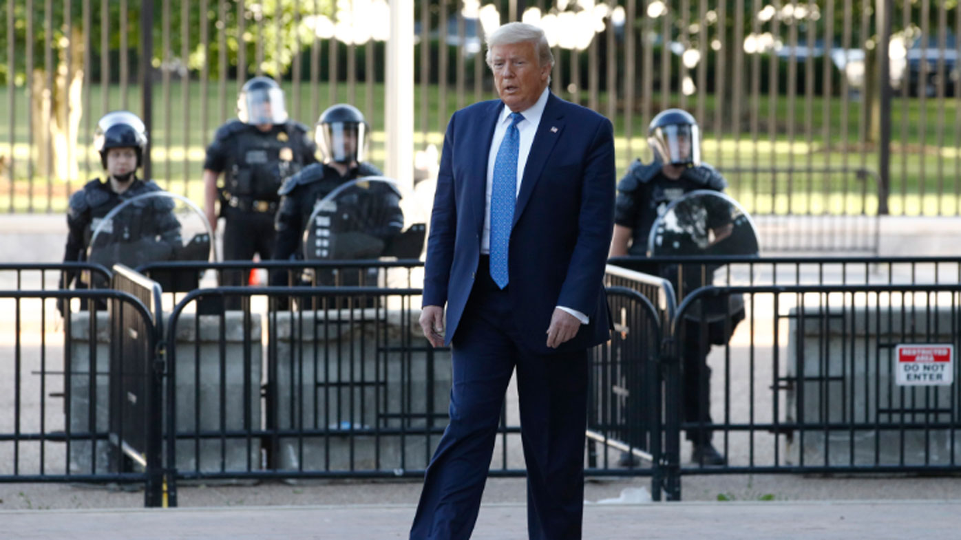 Donald Trump walks from the White House through Lafayette Park to visit St. John's Church in Washington. 