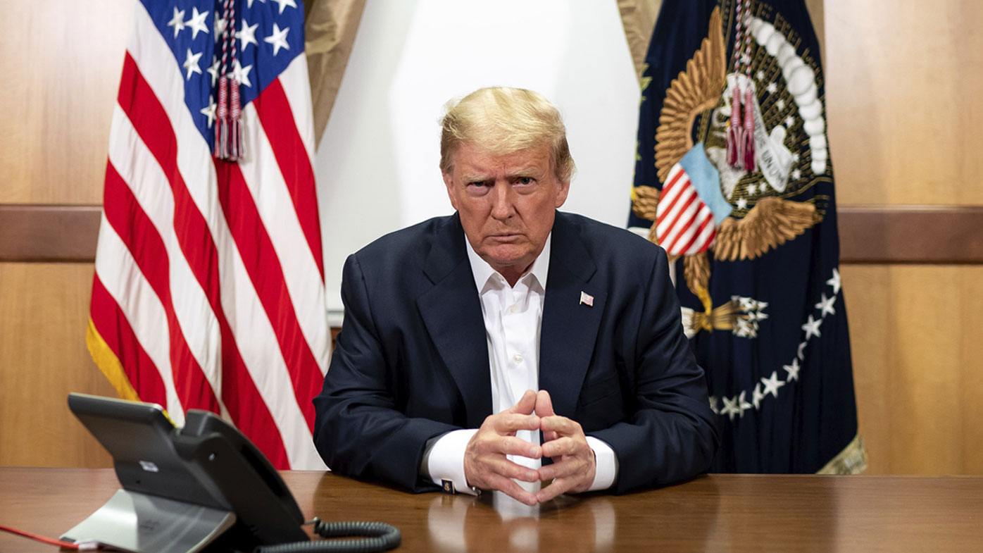 President Donald Trump listens during a phone call with Vice President Mike Pence, Secretary of State Mike Pompeo, and Chairman of the Joint Chiefs of Staff General Mark Milley, in his conference room at Walter Reed National Military Medical Center.