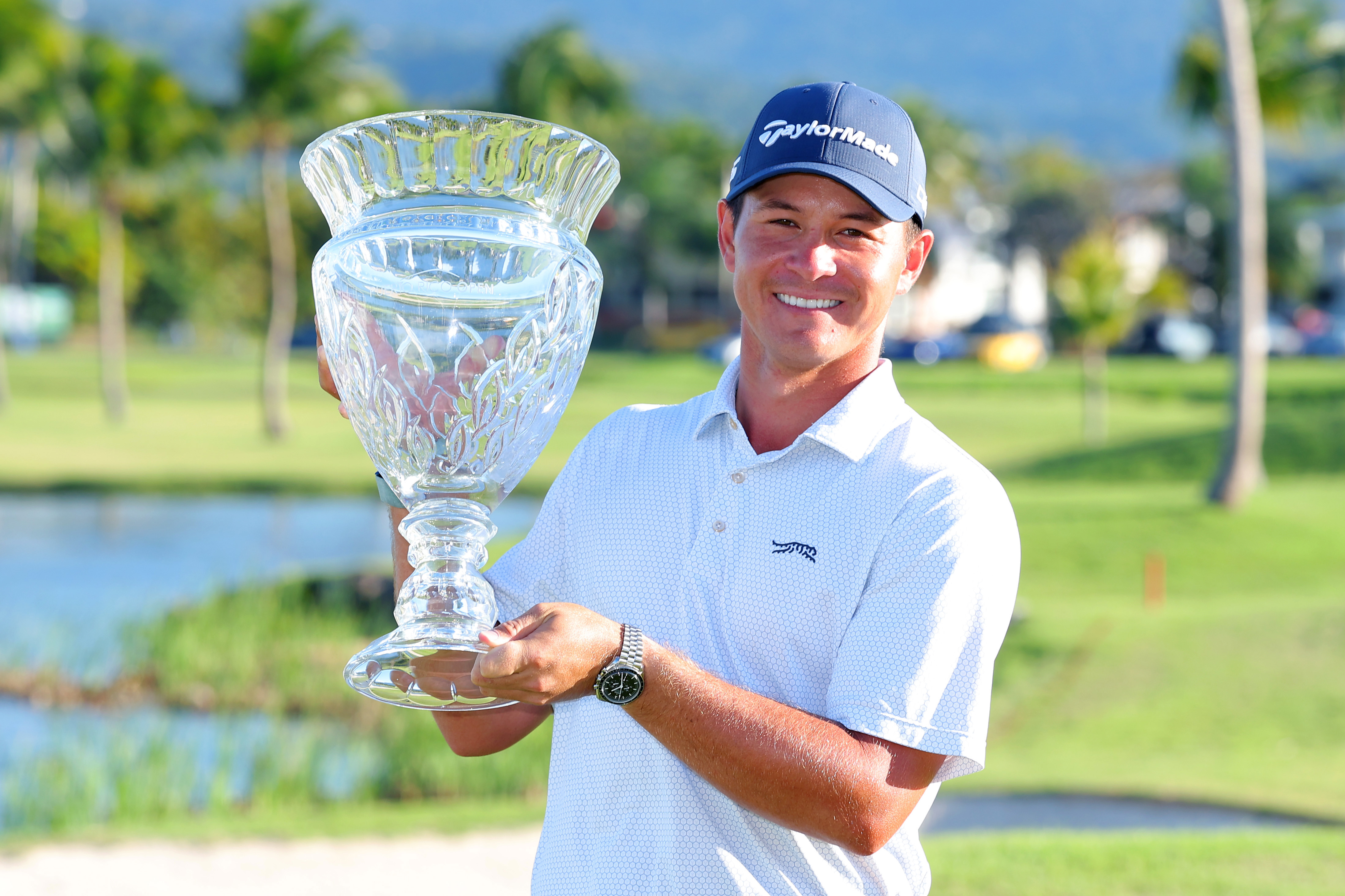 Karl Vilips of Australia poses with the winner's trophy after winning the Puerto Rico Open.