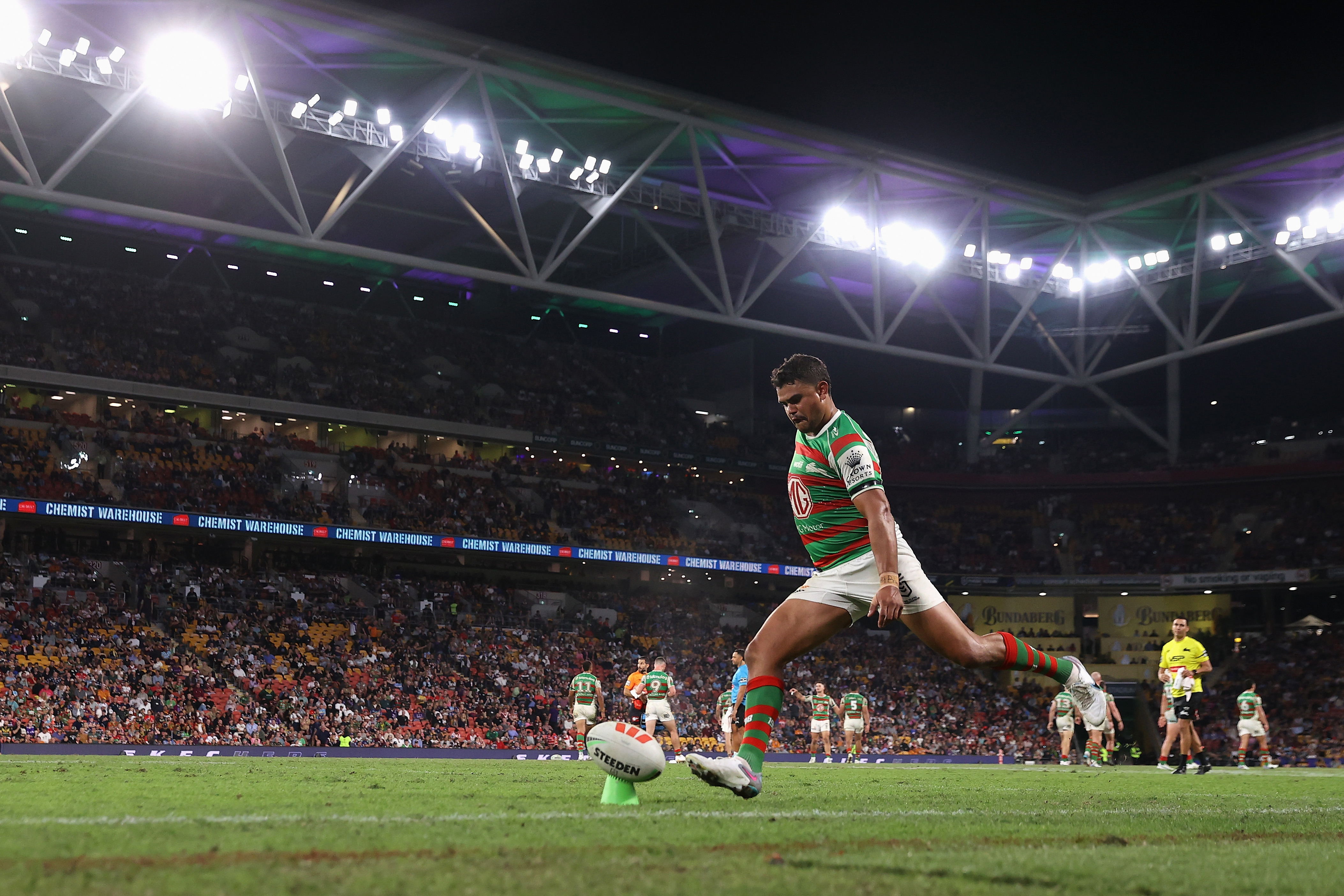 Latrell Mitchell of the Rabbitohs kicks a conversion during Magic Round.