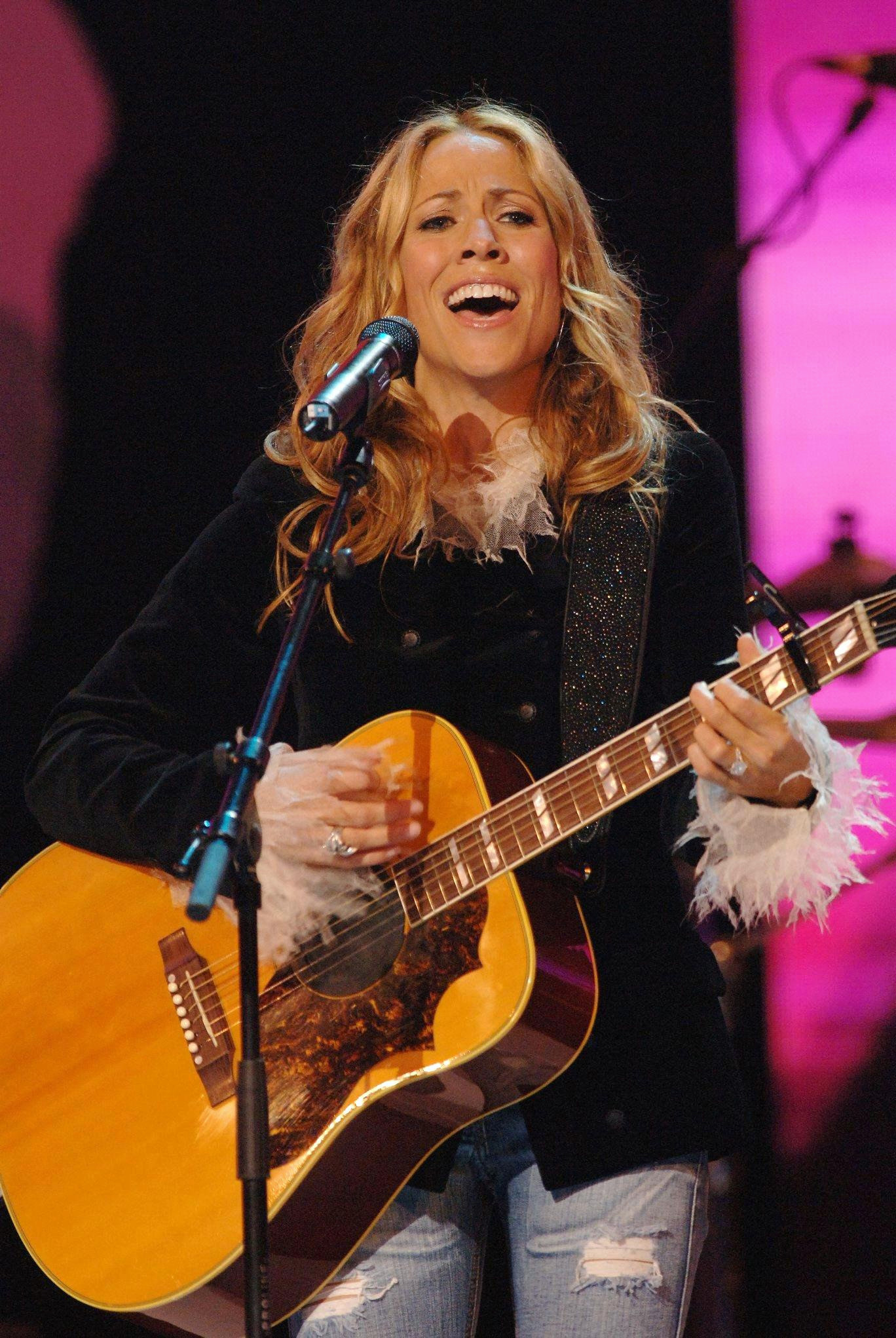 Sheryl Crow performing at a breast cancer fundraiser at the Royal Albert Hall in London on September 18, 2005. 