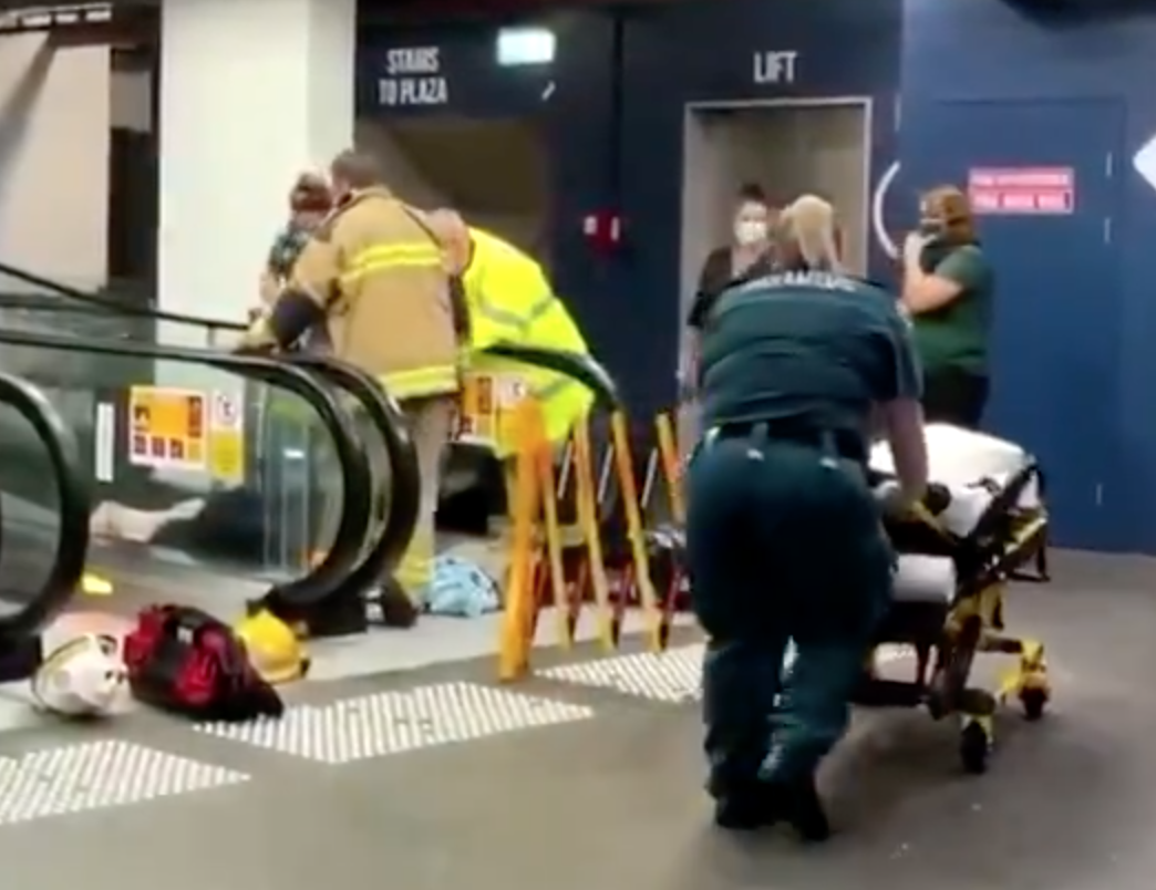 A woman has had to be cut free after becoming caught in an escalator on the Gold Coast, being rushed to hospital after the ordeal. 