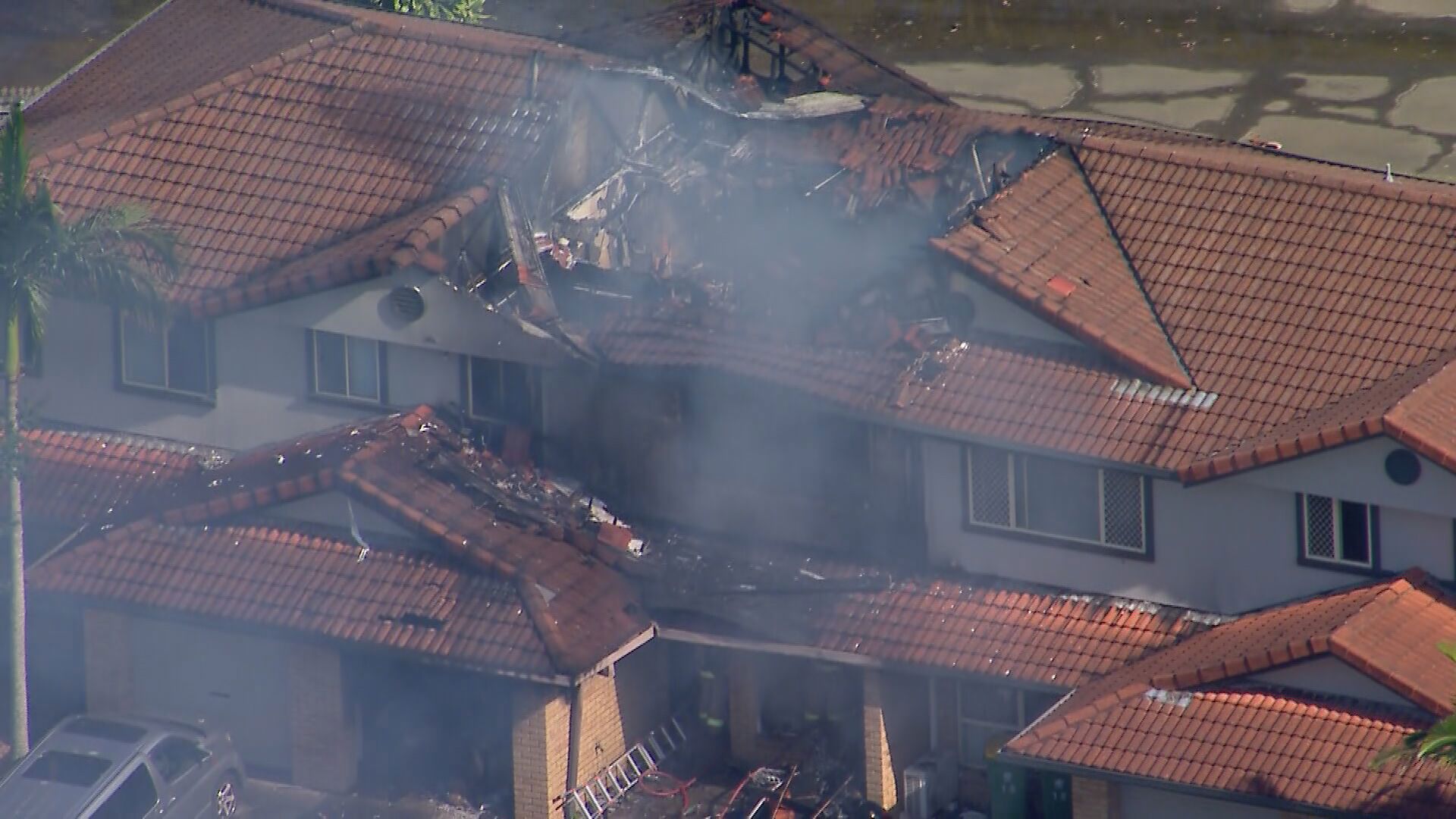 Two people are feared dead after flames engulfed a row of townhouses in Thorneside