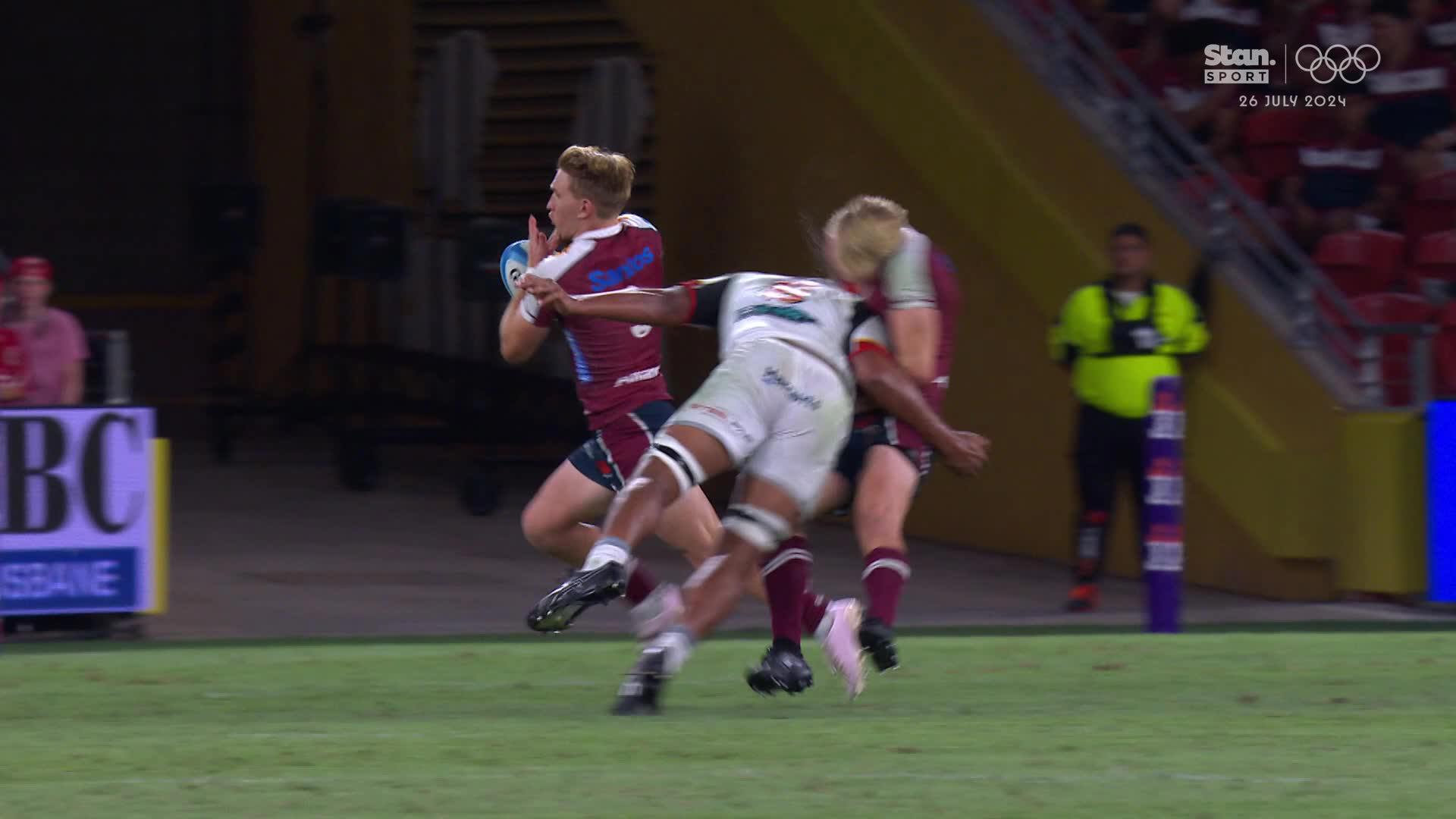 Reds star Tom Lynagh is flattened by Samipeni Finau of the Chiefs.