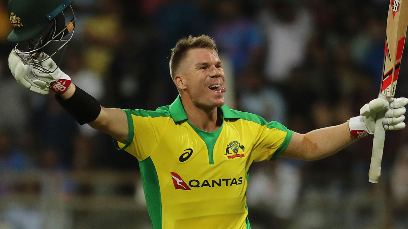 David Warner celebrates his century against India in Mumbai.