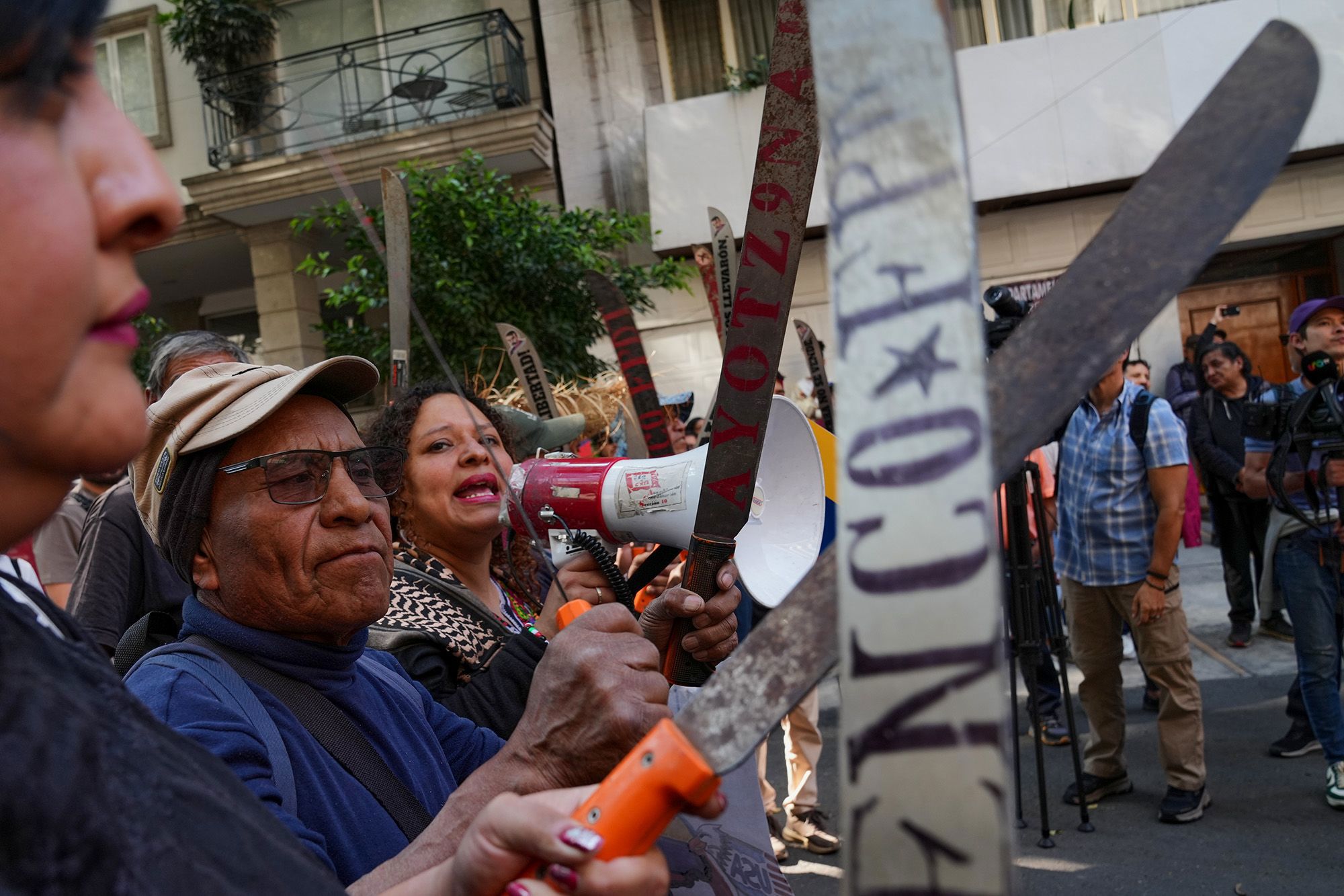 Farmers from Atenco with machetes gather outside Venezuela's embassy to protest against the US capture of President Nicolas Maduro in Mexico City.