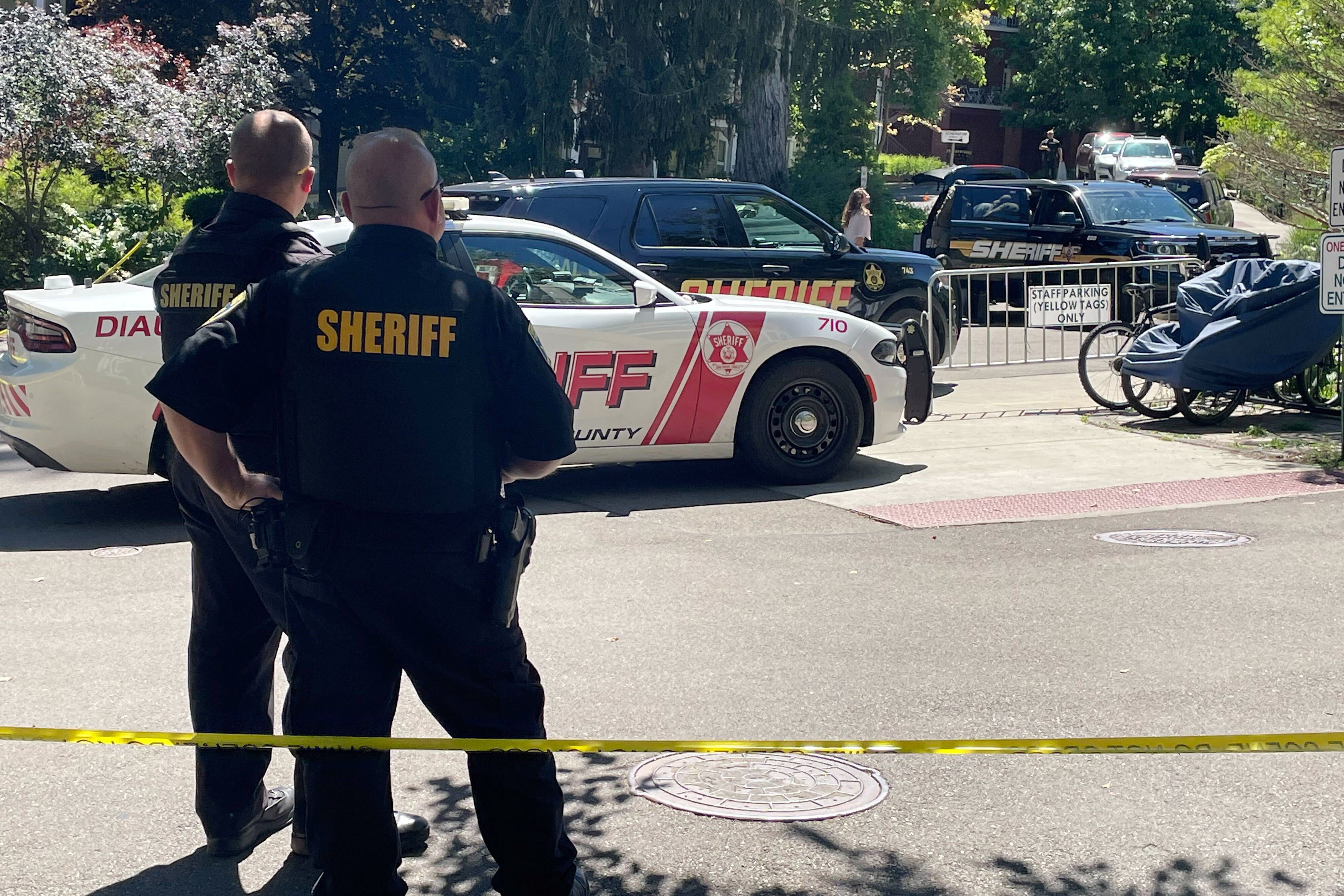 Law enforcement stand watch outside at the Chautauqua Institution after author Salman Rushdie was attacked during a lecture, Friday, Aug. 12, 2022, in Chautauqua, N.Y