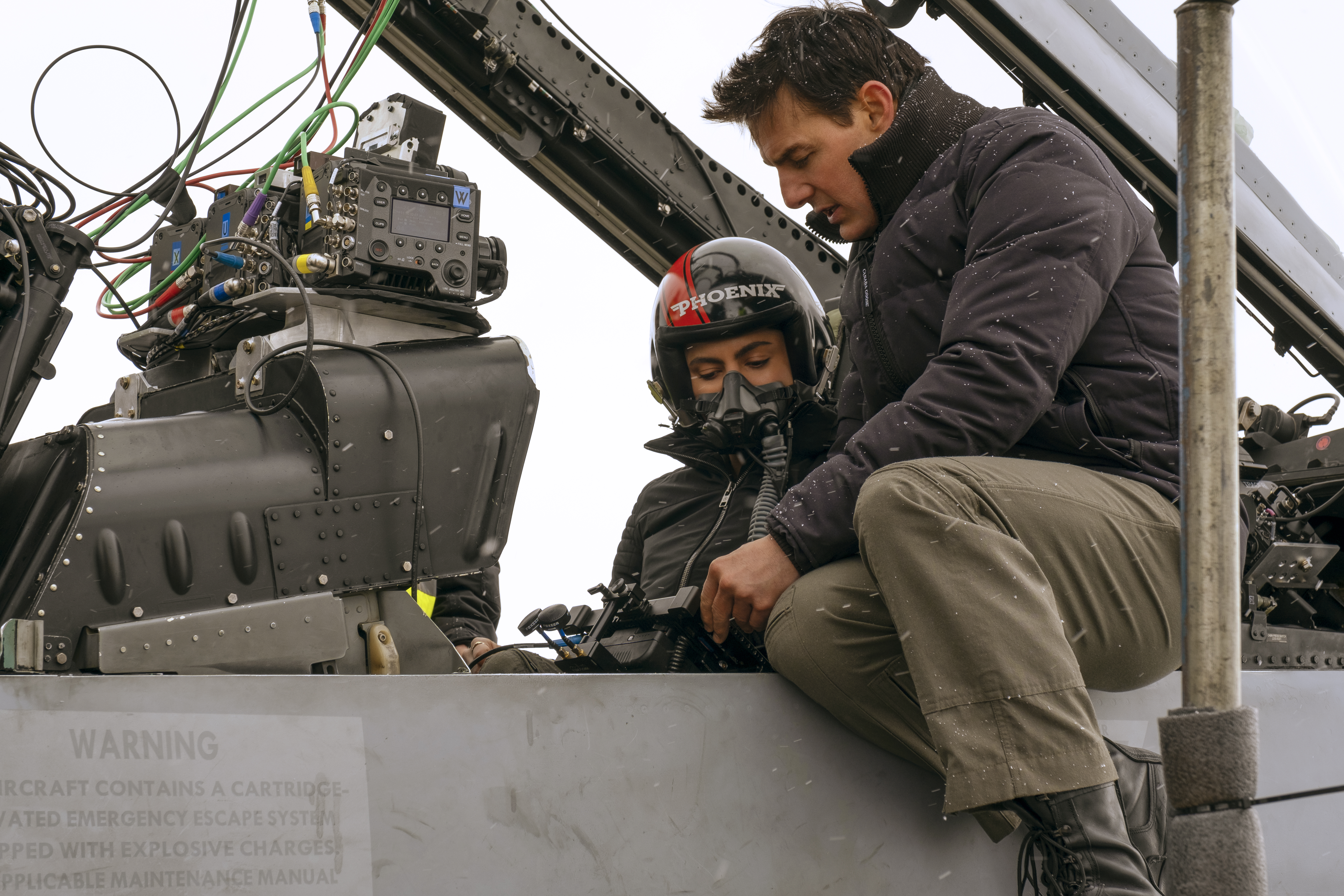 Monica Barbaro and Tom Cruise on the set of Top Gun: Maverick.