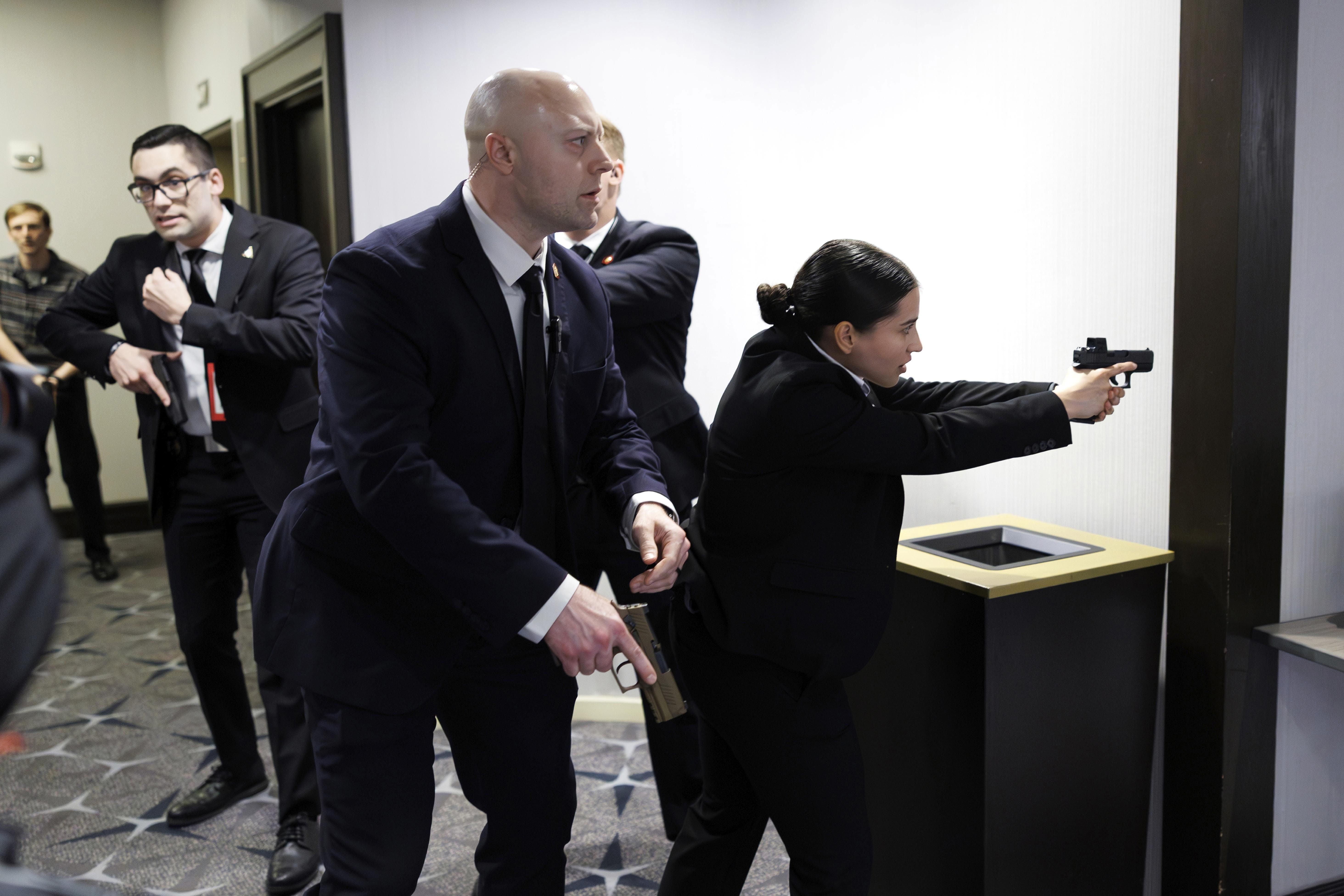 Members of law enforcement respond during the White House Correspondents Dinner shooting.