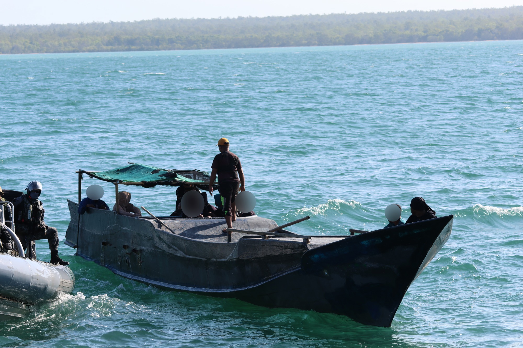 Seventeen illegal fisherman have been escorted out of Australian waters after two seperate boats were caught off Western Australia. 