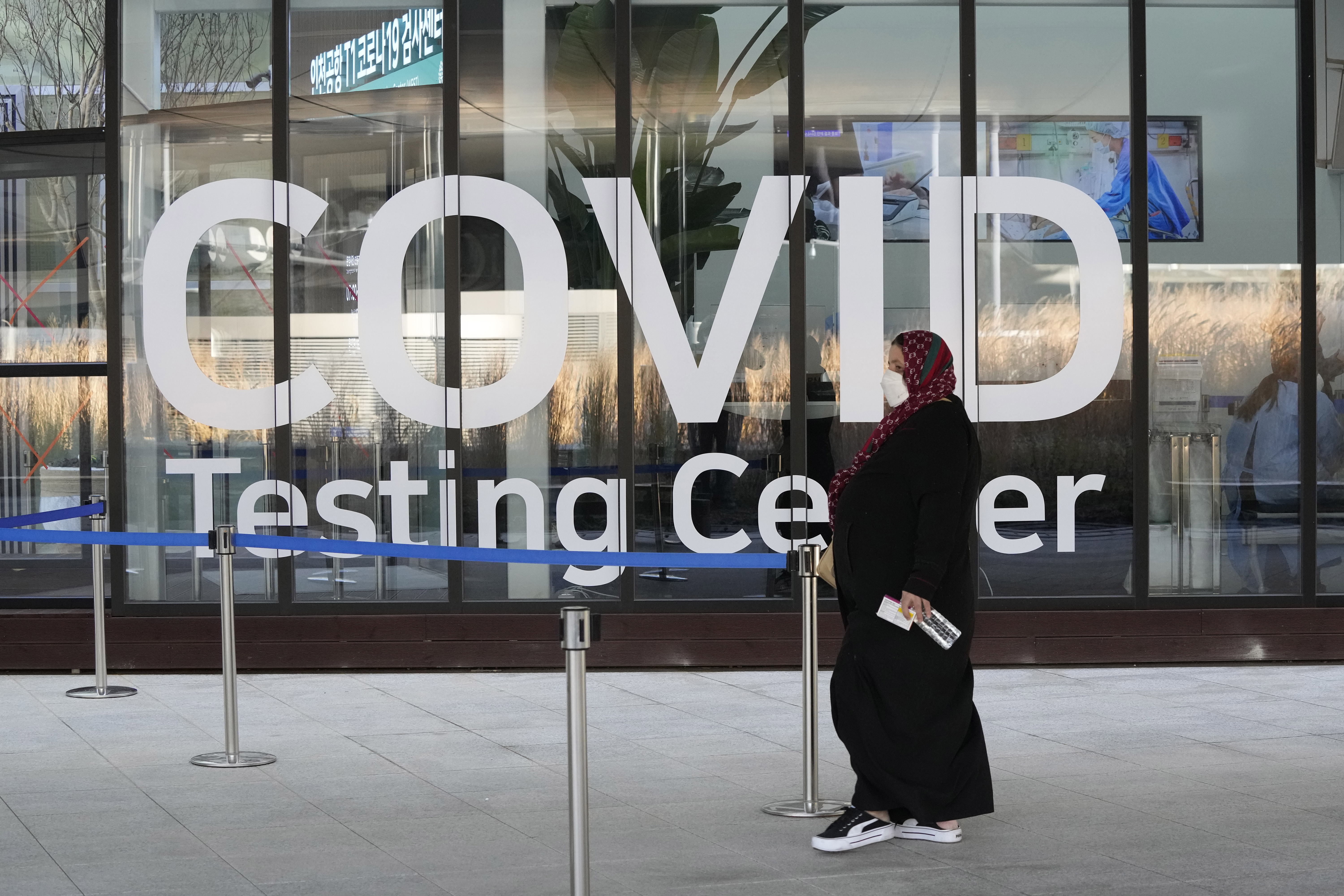 A traveller arrives to enter into a COVID-19 testing centre at the Incheon International Airport In Incheon, South Korea, Wednesday, Dec. 1, 2021