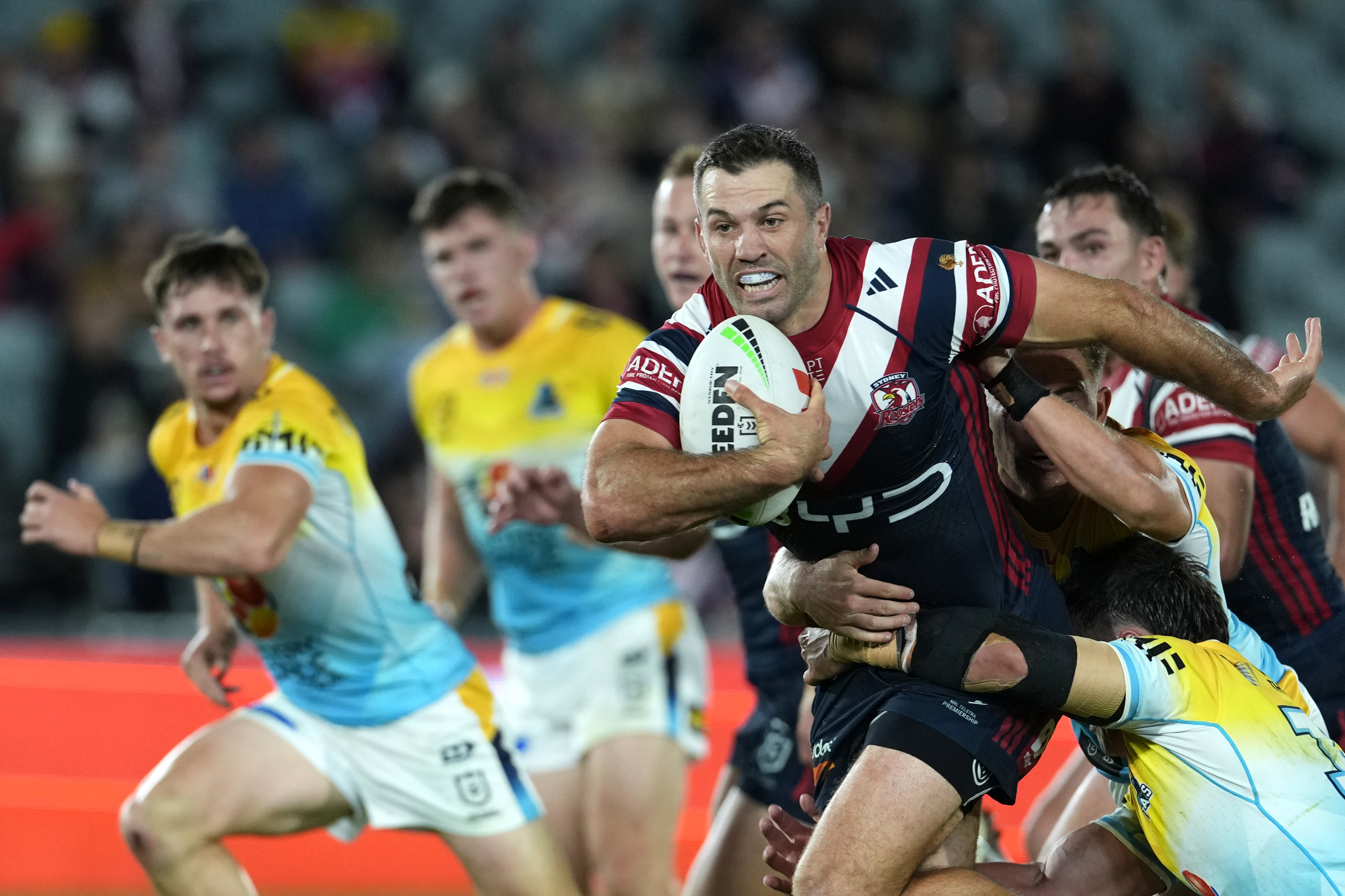 James Tedesco makes a run against the Titans.