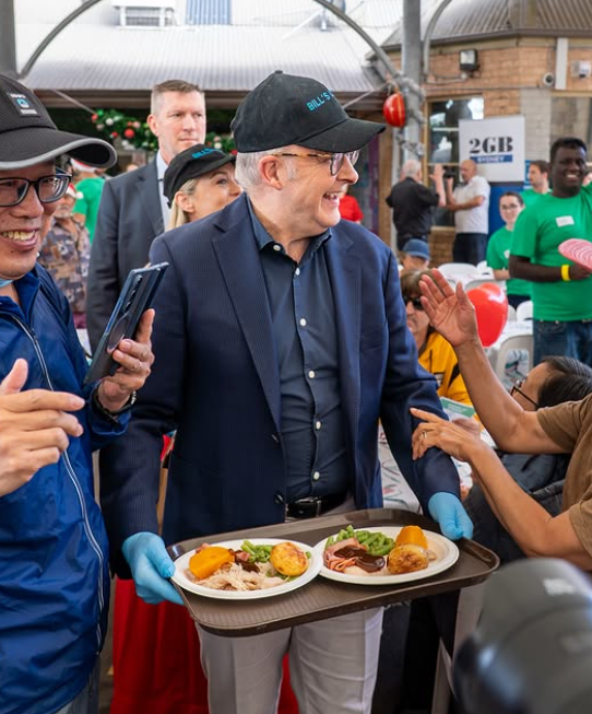 Albanese shared photos of himself serving Christmas lunch at Bill Crews and the Exodus Foundation with NSW Premier, Chris Minns.