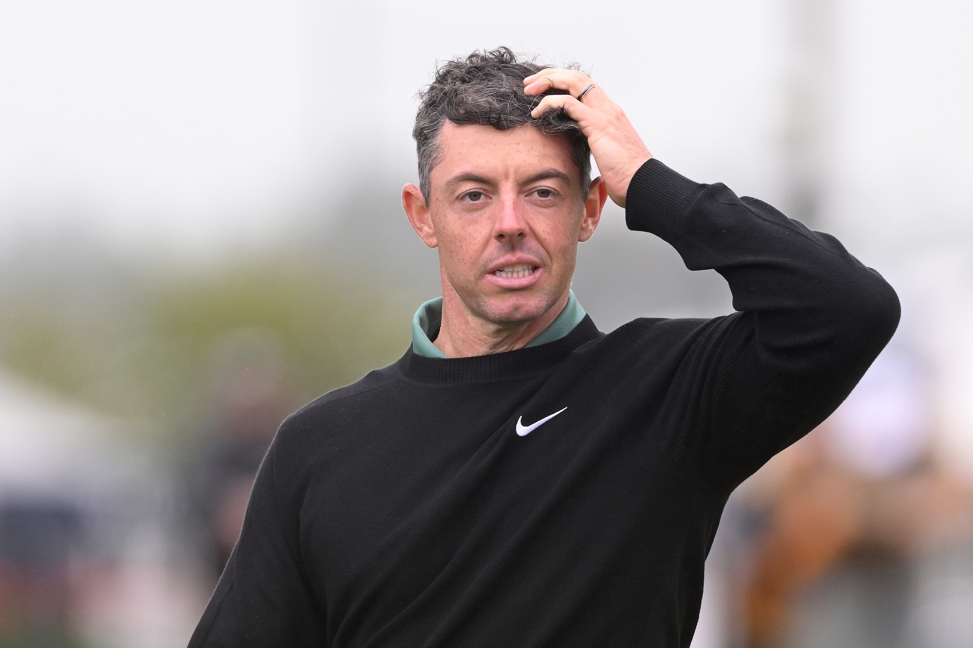 Rory McIlroy of Northern Ireland reacts on the 18th green on day one of The 152nd Open championship at Royal Troon on July 18, 2024 in Troon, Scotland. (Photo by Ross Kinnaird/Getty Images)