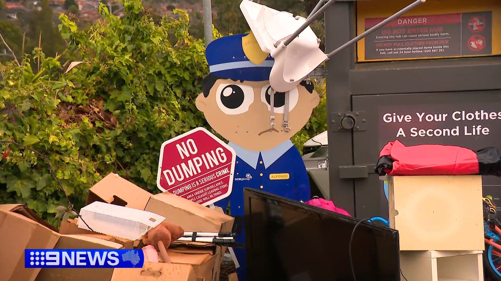 Illegal dumping at a clothing donation bin.