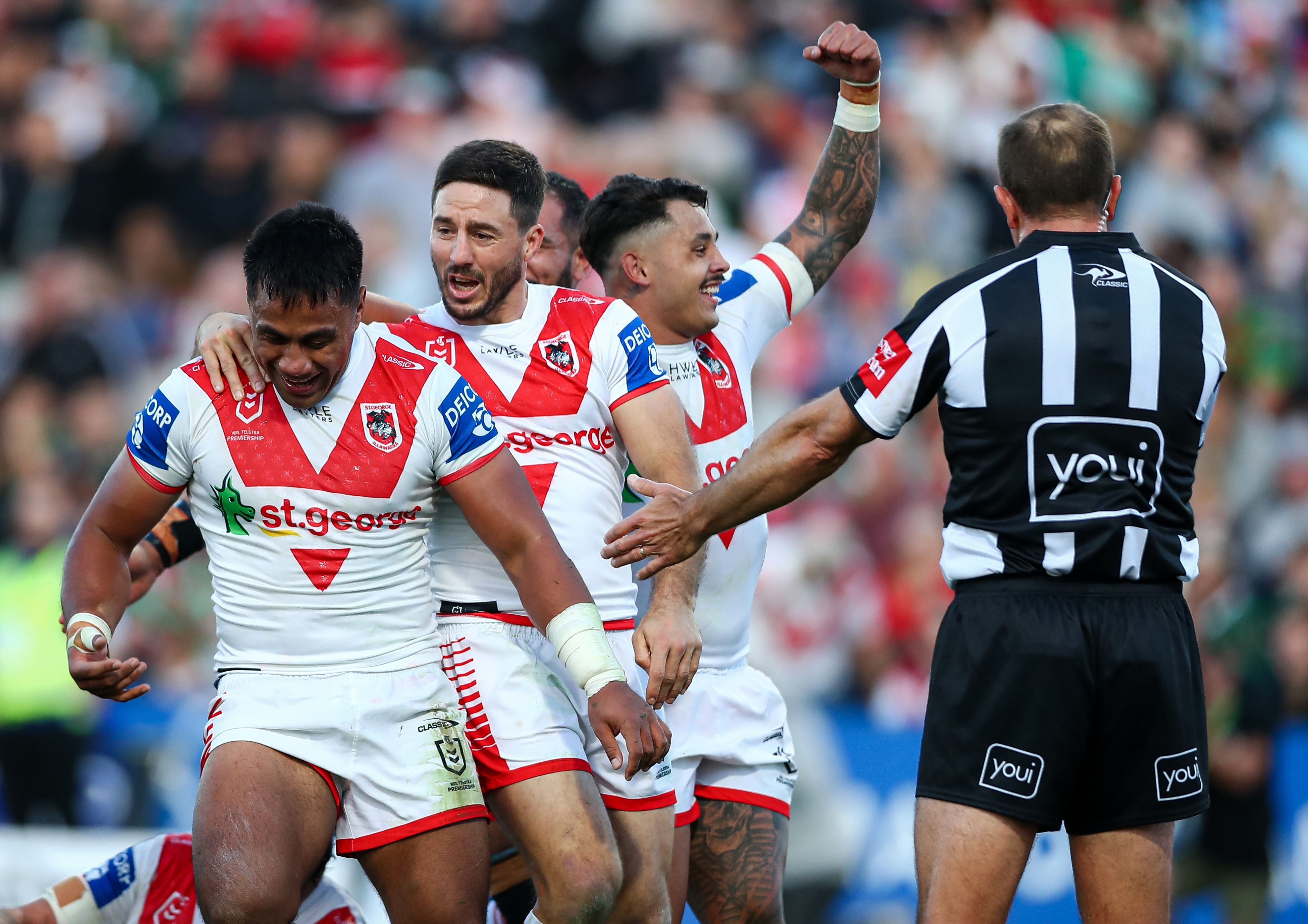 The Dragons celebrate Michael Molo's try against South Sydney.