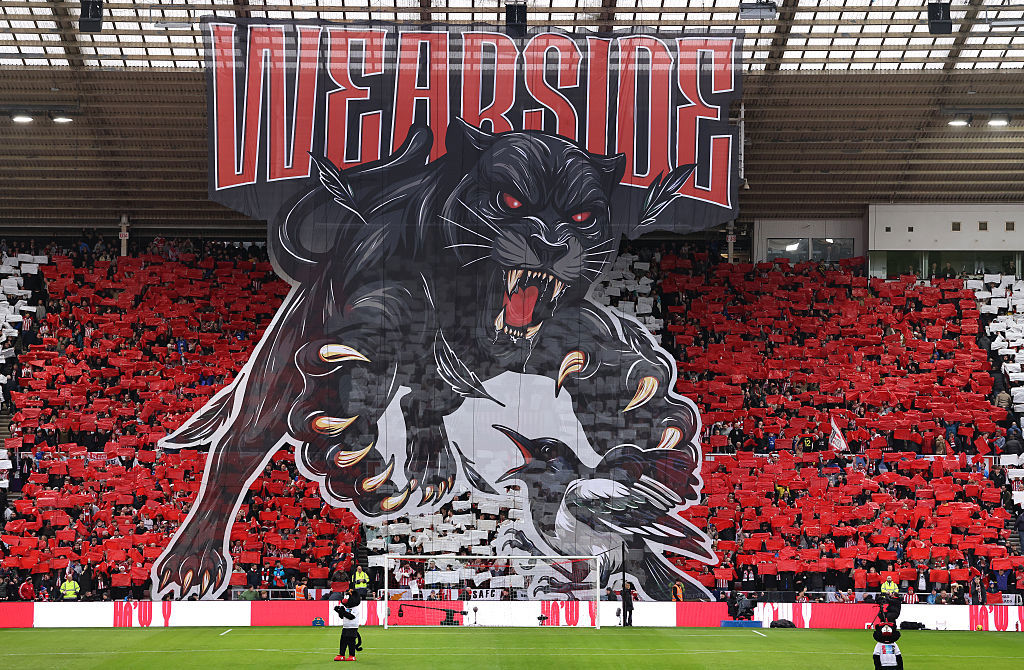 A Wearside tefoil showing a black cat and a magpie.