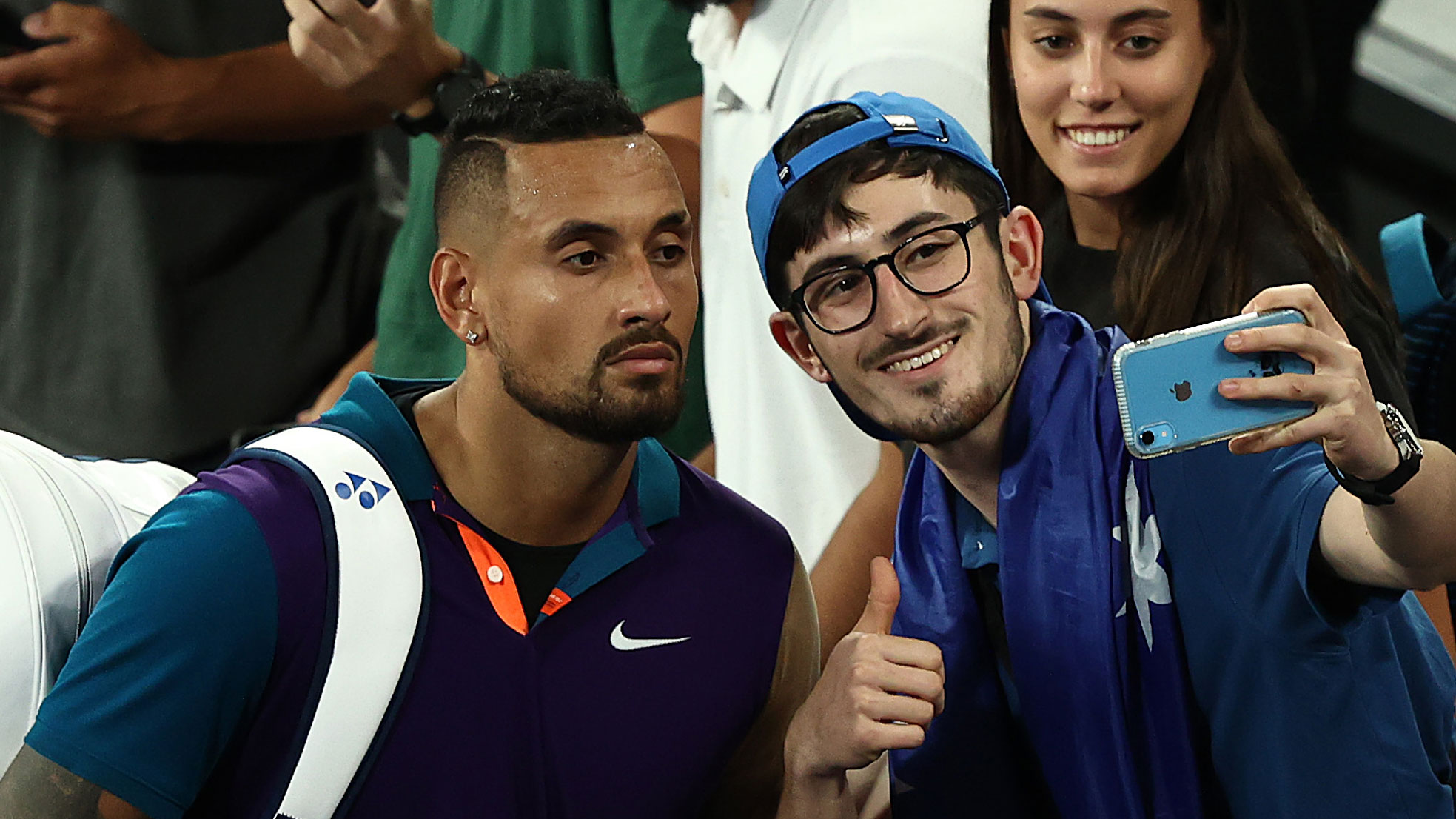 Nick Kyrgios takes a selfie with a fan after his Australian Open win over Ugo Humbert.