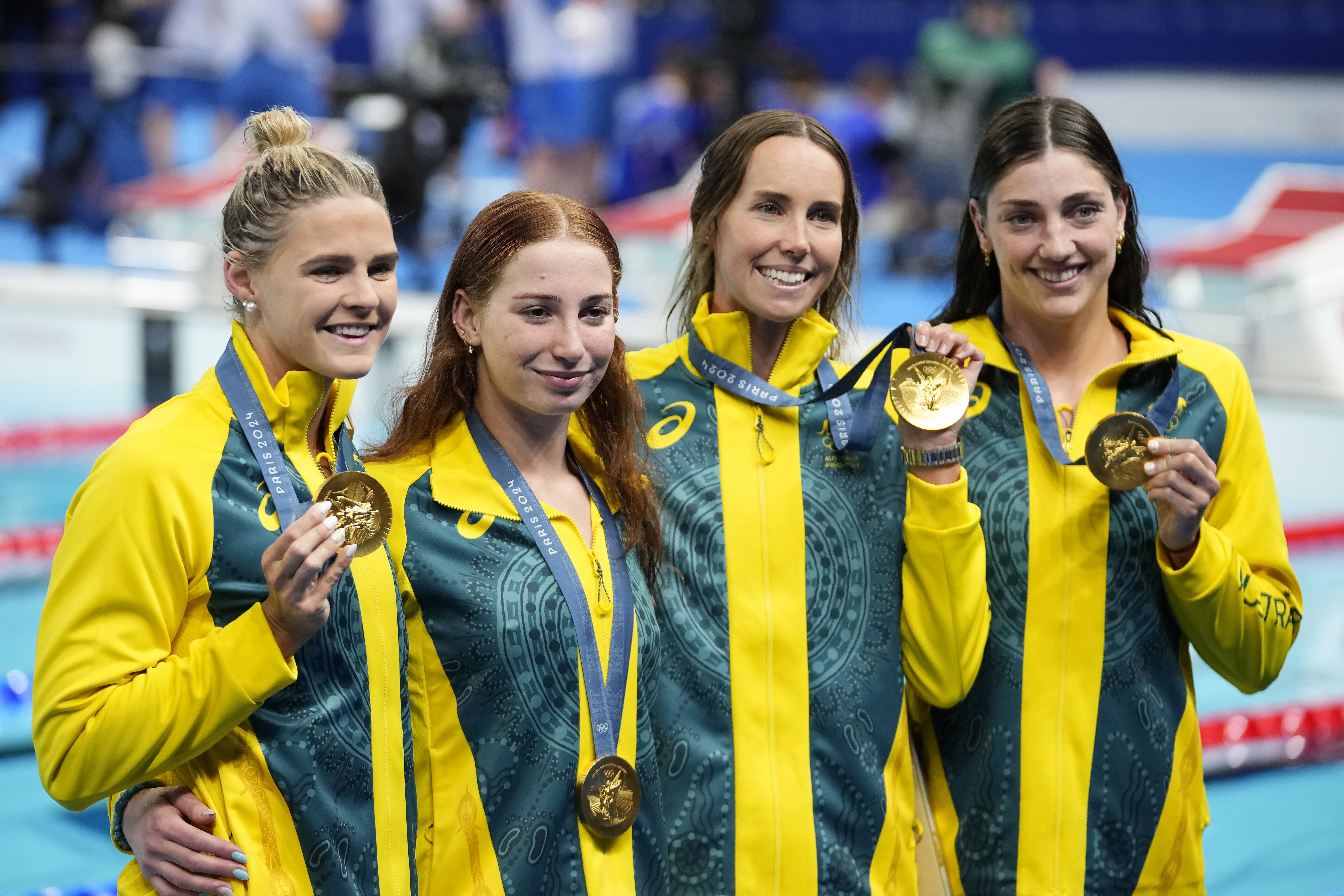 Australia's Shayna Jack, Mollie O'Callaghan, Emma Mckeon and Meg Harris, from left, celebrate after winning the women's 4x100-meter freestyle relay final at the 2024 Summer Olympics, Saturday, July 27, 2024, in Nanterre, France. (AP Photo/Petr David Josek)