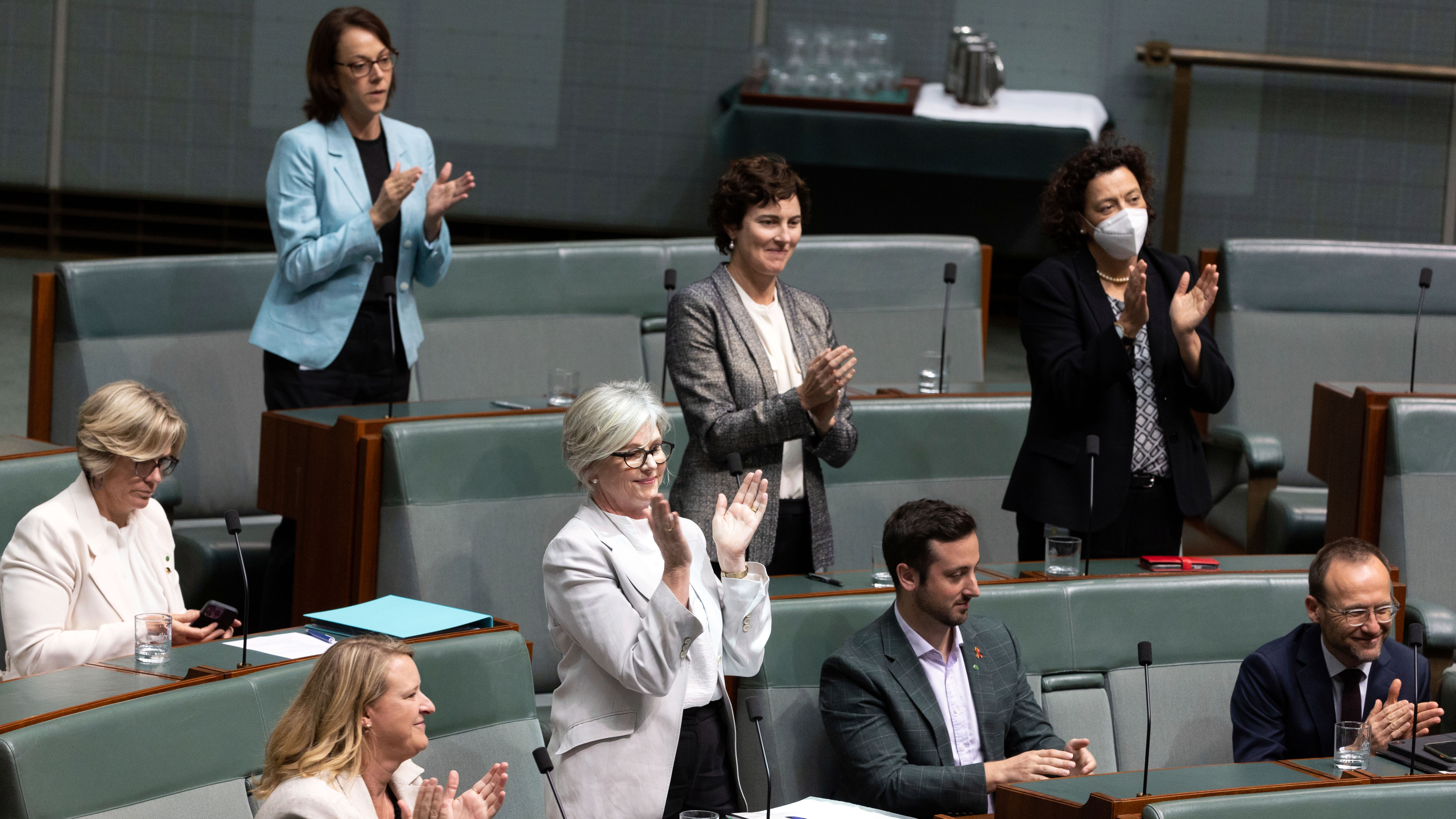 Crossbenchers applaud after the National Anti-Corruption Commission Bill passed the House of Representatives
