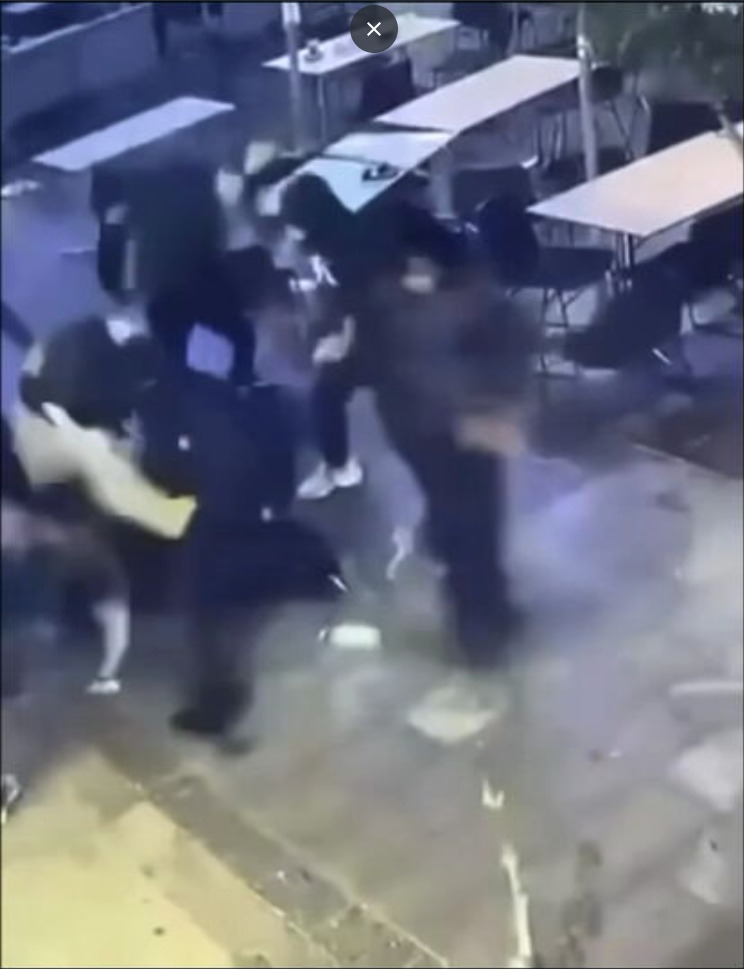 One of the masked people was seen wielding a machete.
