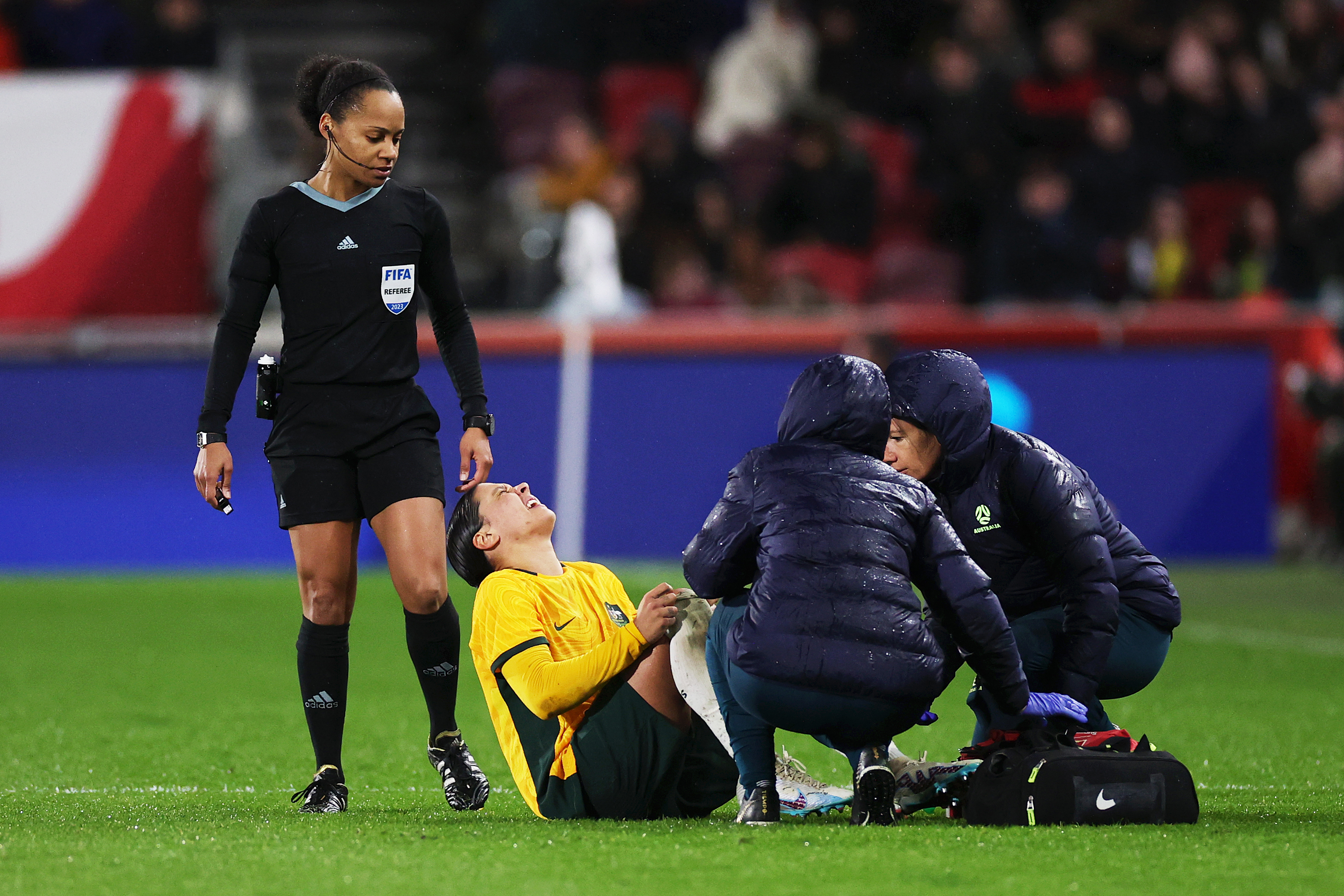 Sam Kerr of Australia receives medical treatment.
