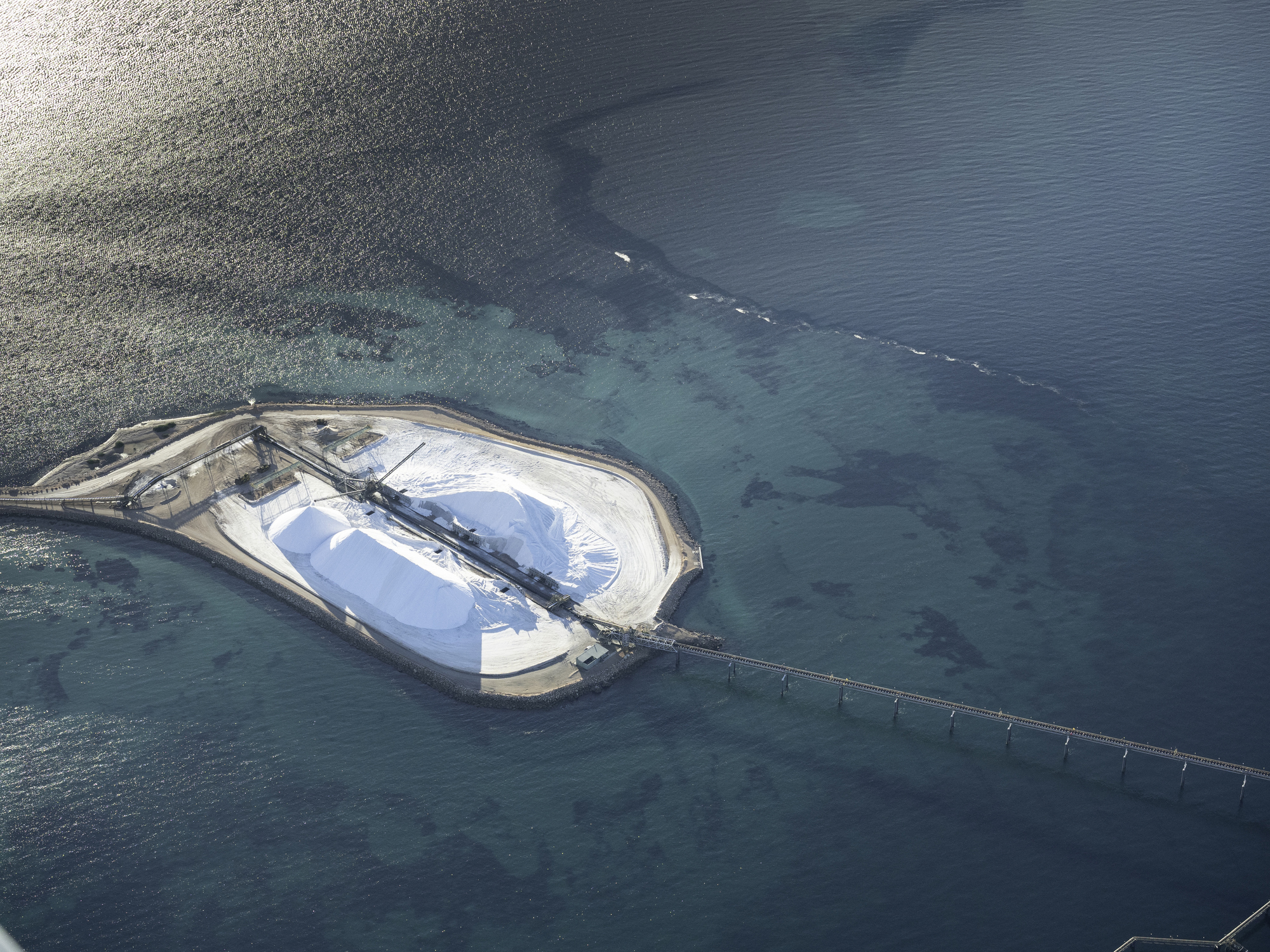 Aerial photo taken from a small plane showing salt works below at Useless Loop, Shark Bay, Western Australia