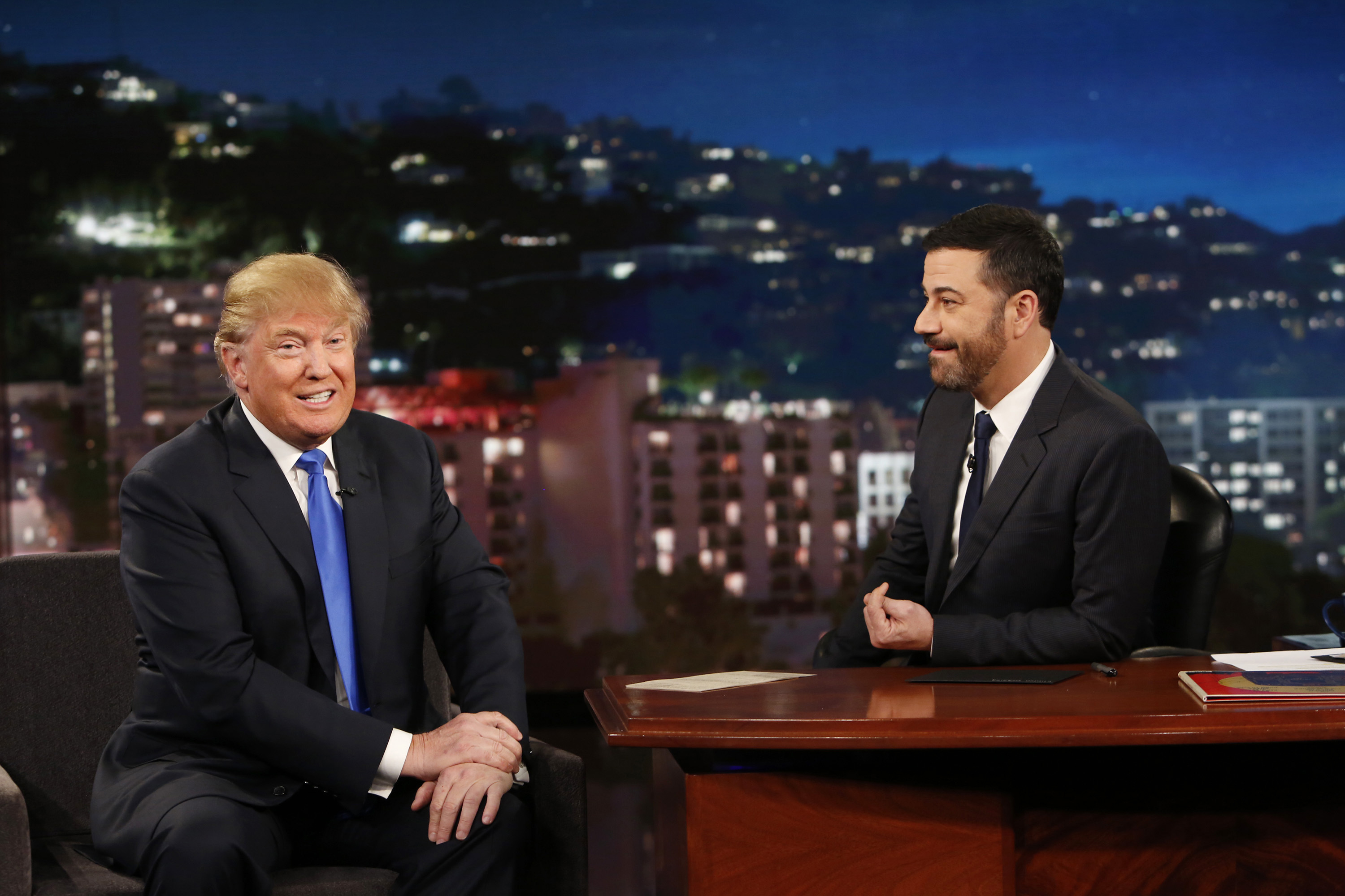 This photo provided by ABC shows guest Republican Presidential candidate Donald Trump, left, with host Jimmy Kimmel, on Jimmy Kimmel Live on Wednesday, Dec. 16, 2015, in Los Angeles. The ABC show airs every weeknight, 11:35 p.m. - 12:41 a.m., ET. (Randy Holmes/ABC via AP)