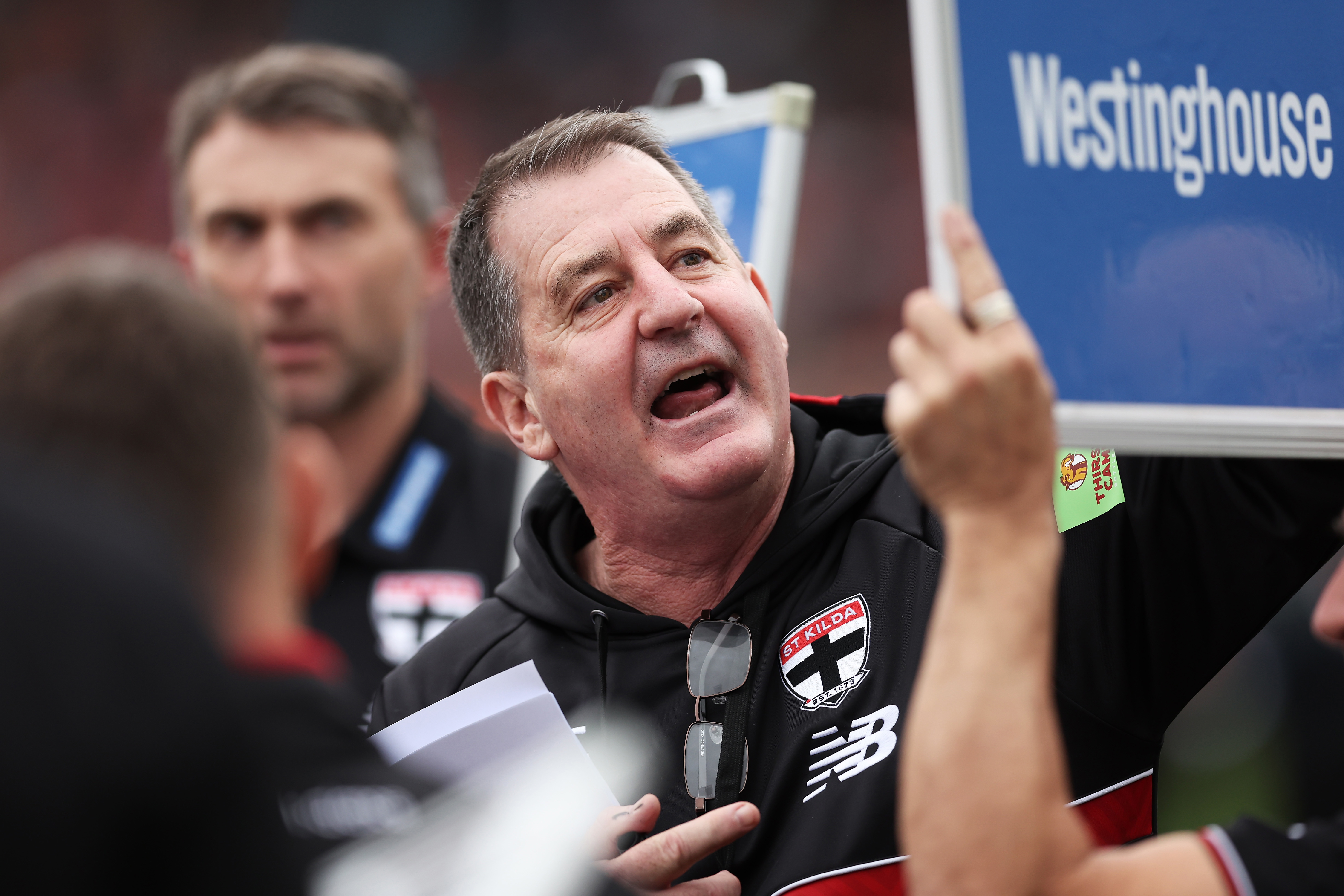 SYDNEY, AUSTRALIA - AUGUST 24:  Saints head coach Ross Lyon speaks to players at three quarter time during the round 24 AFL match between Greater Western Sydney Giants and St Kilda Saints at ENGIE Stadium on August 24, 2025 in Sydney, Australia. (Photo by Matt King/AFL Photos/via Getty Images)