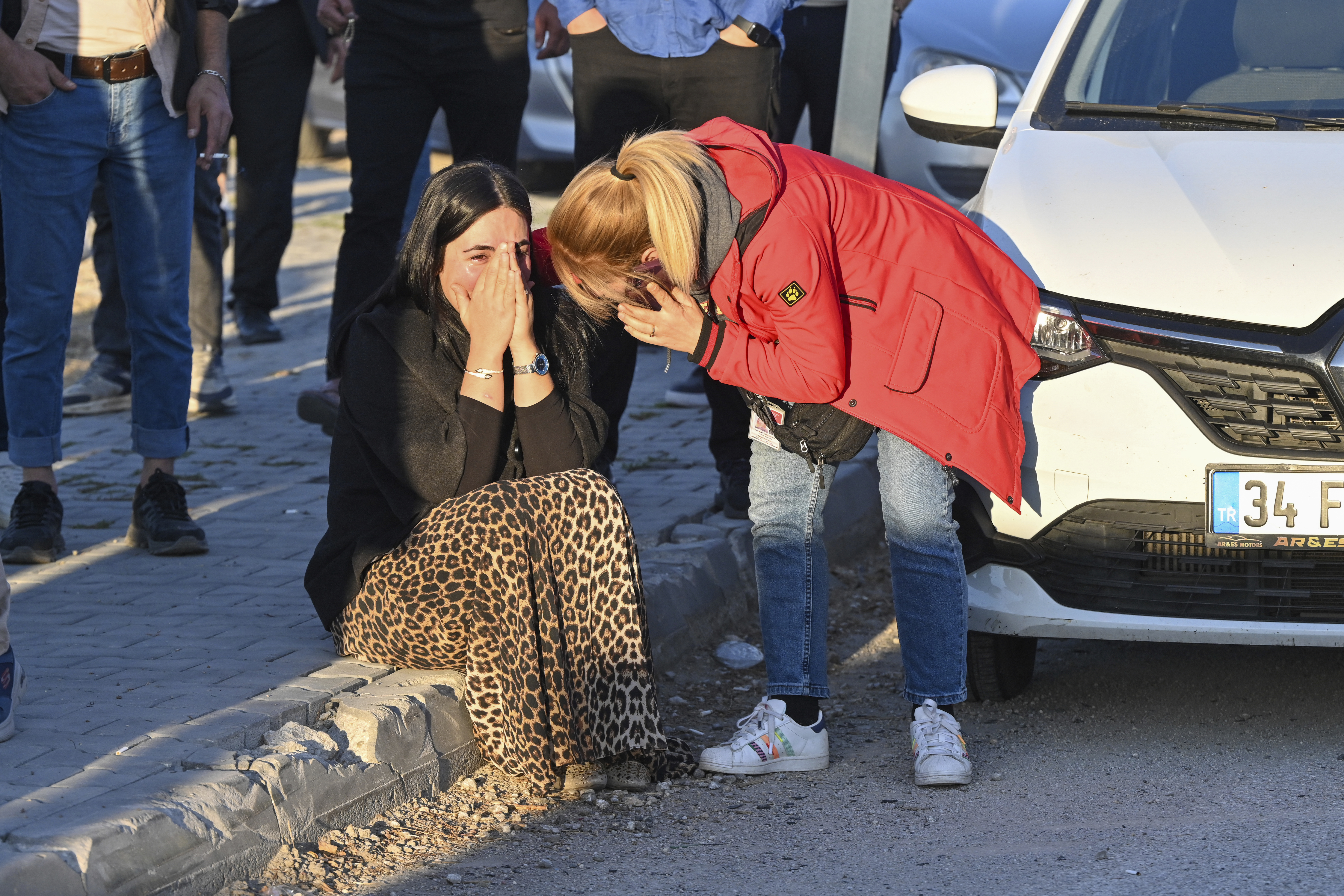 People gather outside of Turkish Aerospace Industries Inc. at the outskirts of Ankara, Turkey, Wednesday, Oct. 23, 2024. 