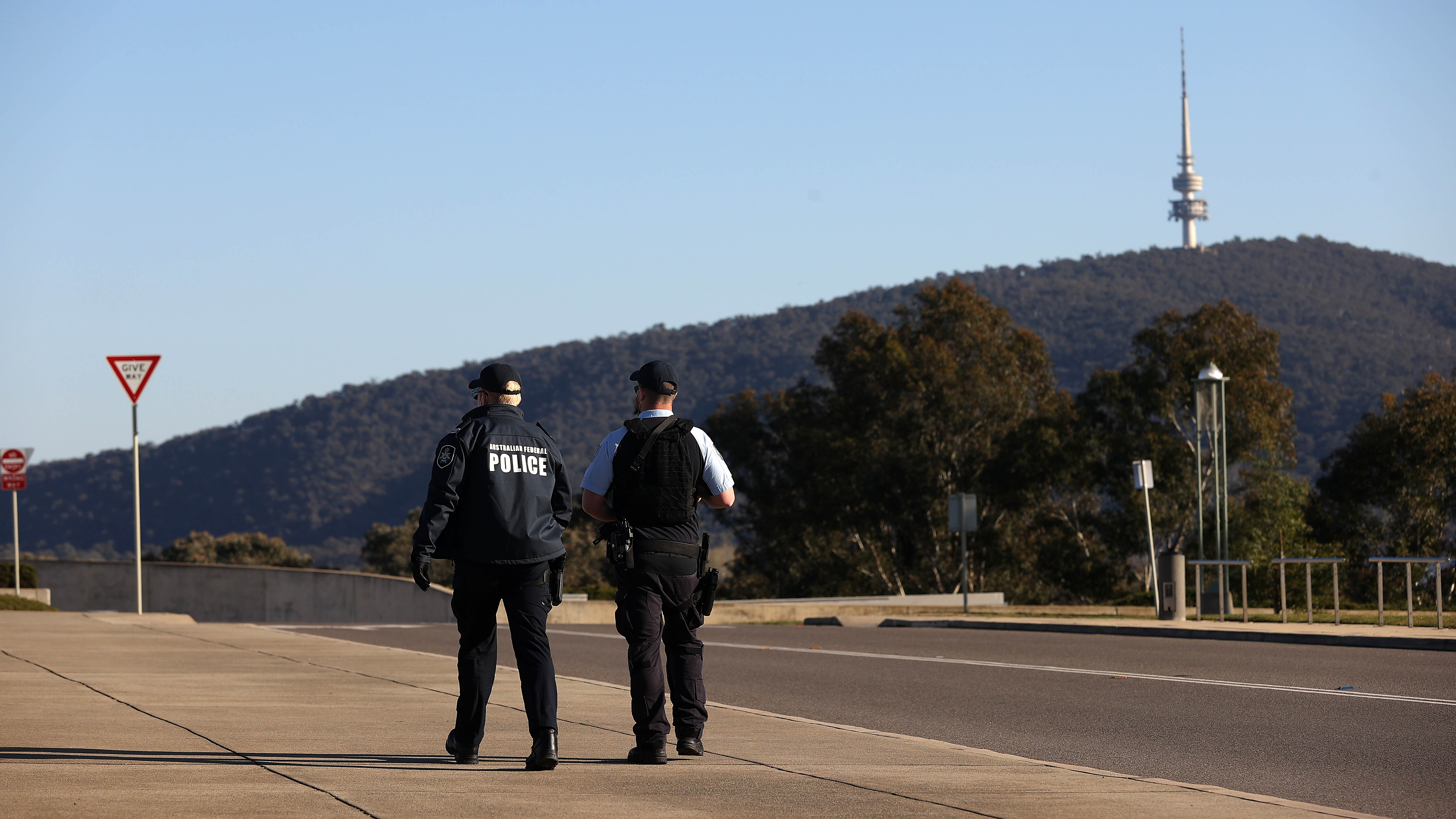 Police patrol around Parliament House in Canberra.